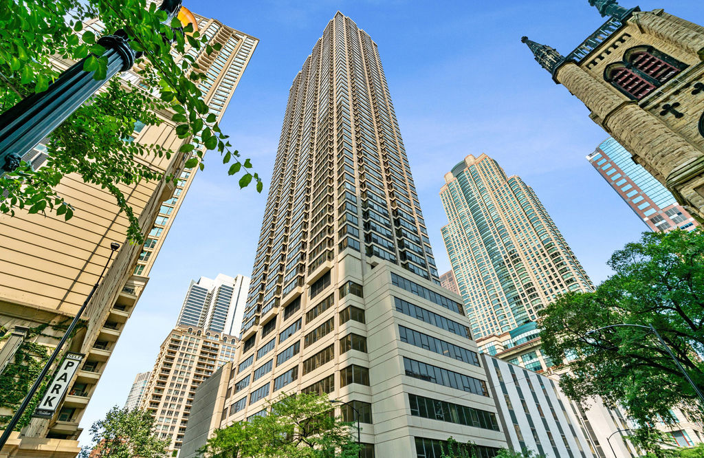 Move right in - this spacious, fully furnished one-bedroom, one-bath condo in the heart of River North, just one block from Michigan Avenue shopping and surrounded by premier dining, is ready for its new owner. Enjoy beautiful city views, including the iconic Hancock Building, from windows equipped with motorized shades. The open-concept layout features a large kitchen with stainless steel appliances, granite countertops, and a 4-seat breakfast bar. Brand new luxury vinyl flooring extends throughout the entire unit. The large bedroom easily accommodates a king-size bed and furniture, with both a walk-in closet and an additional closet for ample storage. The generously sized bathroom offers an extended vanity with plentiful drawers and a linen closet. Both the bedroom and living area have new HVAC systems. One of the few condo buildings in Chicago allowing 31-day minimum furnished and unfurnished rentals-ideal for personal use or rental income. Well run full-amenity building with 24-hour doorman, two-story sundeck with outdoor pool, fitness center, business center, movie theater, and party room. Garage parking available for rent or purchase (subject to availability). Assessments include all utilities except electric. Prime location to walk everywhere-Whole Foods, the Mag Mile, lakefront and riverfront trails-and enjoy all River North has to offer.