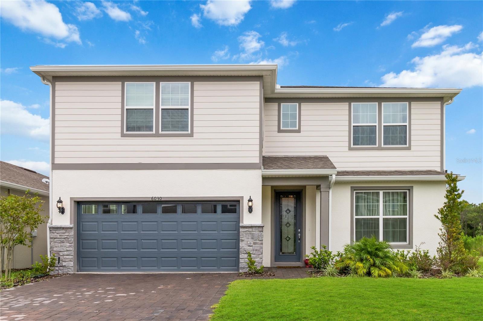 Paid-Off Solar = $34K Value + Monthly Savings! Welcome to this beautifully upgraded 4-bedroom home in the desirable Pinewood Reserve community. Set on a premium corner waterfront lot, this two-story layout includes 4 bedrooms, an office, a spacious bonus room, 3.5 bathrooms, and a 2-car garage—all packed with nearly $97,000 in thoughtful upgrades.  Step into the heart of the home: a gourmet kitchen with white cabinetry, quartz countertops, upgraded lighting, and built-in stainless steel appliances. The oversized kitchen island makes the space perfect for cooking, gathering, and entertaining—an upgrade valued at $20,000.  Natural light pours into the living area through custom 18-foot sliding glass doors (a $15K upgrade), opening to a large paver patio and tranquil pond views. The entire second floor and staircase feature luxury vinyl plank flooring ($12K), offering durability and modern style throughout.  The primary suite, located on the first level, includes a walk-in shower, dual vanities, and a custom-built walk-in closet system ($13K). Upstairs you'll find spacious secondary bedrooms, a full laundry room with upgraded storage, and a versatile bonus area.  Additional highlights include: • 33-panel paid-off solar system ($34K) – save over $300/month • Upgraded washer & dryer package ($4K) • Premium corner lot with extra windows and added natural light ($12K) • Modern fans, blinds, and lighting fixtures throughout ($2K)  Pinewood Reserve features resort-style amenities including a pool, playground, and scenic nature trails. Located just minutes from Lake Nona, the Orlando International Airport, Downtown Orlando, and Waterford Lakes, this home offers both convenience and comfort.  Don’t wait to build—this better-than-new home is move-in ready and energy-efficient from day one. Schedule your private tour today and see the difference quality upgrades make.