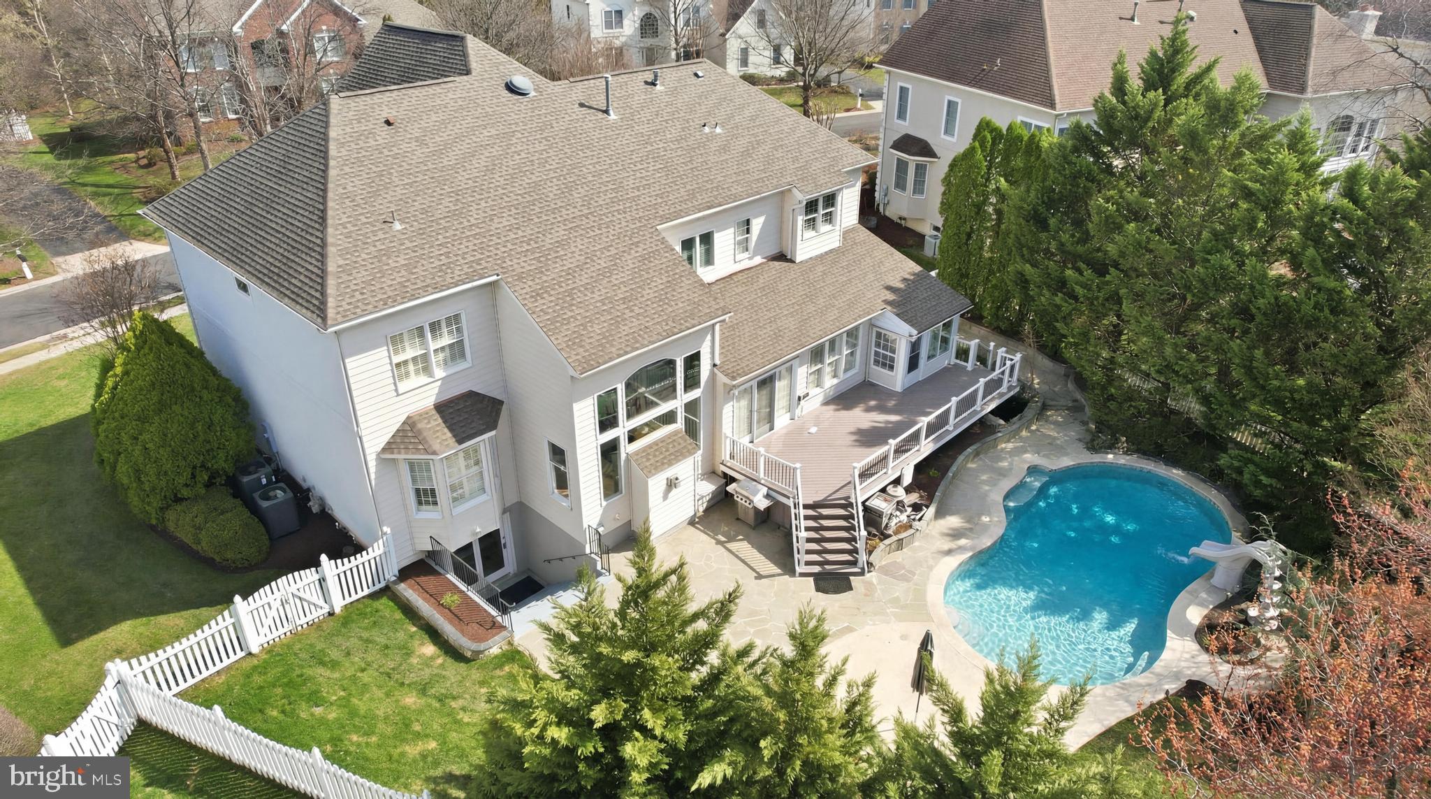 Get ready for resort-style living in Belmont Country Club! ⛳ This impressive north-facing Monroe Versailles model with private heated pool offers over 5,800 square feet of beautifully finished living space with 5 bedrooms and 4.5 bathrooms, blending luxury, comfort, and everyday elegance.The home features excellent curb appeal with a three-car side-load garage  and slate walkway leading to the front entrance. Step inside to a grand two-story foyer highlighted by an oak staircase with wrought iron railings, setting the tone for the home’s timeless architectural style.The dramatic two-story family room features a stacked stone fireplace  and a wall of windows that fill the space with natural light.French doors lead to the expansive Trex deck and slate patio, overlooking the private heated pool with slide ‍♂️ and newly refinished Cool Deck pool deck. The pool was recently refinished with EcoFinish, creating a true resort-style outdoor setting for relaxing or entertaining. Just off this area is a four-season sunroom with a built-in hot tub ♨️, perfect for year-round enjoyment.The main level includes front and back staircases, formal living and dining rooms perfect for entertaining, and a private home office. Hardwood and ceramic tile flooring run throughout the main level, along with a spacious mudroom/laundry room and powder room with access to the three-car garage.The refreshed gourmet kitchen ️ showcases white cabinetry, quartz countertops, classic white subway tile backsplash, center island, beverage center, and stainless steel appliances including a gas cooktop and double wall ovens. The adjoining solarium and breakfast area ☀️ create a bright and inviting space for everyday living.Upstairs, the primary suite offers a sitting room and oversized walk-in closets. The spa-inspired bath  includes a freestanding soaking tub, frameless glass shower, quartz double vanity, and private water closet.Three additional spacious bedrooms complete the upper level, including a junior suite with private bath, plus two bedrooms that share an updated hall bath with double sinks.The finished walk-up lower level offers a large recreation room, wet bar , second stacked stone fireplace , bedroom, and full bath. Additional areas include a flex room, workshop, and exercise space . New carpet has been installed throughout the lower level, with unfinished areas offering excellent storage.Situated in one of the most desirable locations within the gates of Belmont Country Club, the home is just minutes from Belmont Chase, the Recreation Center, and the clubhouse.Major updates include roof and gutters (2020), HVAC systems (2024) with 16 SEER efficiency, furnace (2020), hot water heater (2024), refinished hardwood floors, new carpet, fresh paint, updated lighting and fixtures, and a recently resurfaced driveway. Additional features include lawn irrigation, landscape lighting, and a whole-house attic fan.Belmont Country Club features an Arnold Palmer Signature golf course ⛳, a 35,000 sq ft clubhouse, dining, tennis , fitness center ️‍♂️, resort-style pools, playgrounds, and scenic walking trails .The HOA includes lawn maintenance, high-speed internet, cable TV, sewer, trash service, and community amenities.Conveniently located near Whole Foods, shopping, and dining at Belmont Chase, with easy access to Route 7, Route 267, Dulles Airport ✈️, and the Ashburn Metro . Located within the highly sought-after Riverside High School pyramid.Luxury living, resort-style amenities, and one of the most desirable communities in Loudoun County. Welcome home to Belmont Country Club.