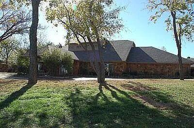 In-Town Estate on 4 Acres with Spacious Home & Expansive Shop.Discover the perfect blend of space, comfort, and versatility with this exceptional in-town acreage property. Situated on approximately 4 fenced acres, this estate features a 7,780 sq/ft custom home and a 3,200 sq/ft fully equipped shop, offering endless possibilities for living, entertaining, or running a home-based business.Home Highlights:Grand living room with saloon-style design, soaring 29-foot ceilings, and a beautiful fireplace,Spacious kitchen featuring an island sink, Jenn-Air cooktop, double ovens, built-in microwave, and abundant storage.Sizable primary suite with a private sitting room and fireplace,Spa-like primary bath with jacuzzi tub and expansive walk-through closet,Second master bedroom with sitting area overlooking the pool,Two bedrooms connected by a Jack & Jill bathroom,Multiple additional rooms perfect for formal dining, office, theater, playroom, or flex space.OEC Fiber Optic high speed internet.Large walk in saferoom and gated drive for security.Outdoor & Property Features:Scenic pond and fully fenced acreage,Concealed inground pool, gazebo, and front yard fountain.Two private wells capable of supplying the home.All-electric home with aerobic septic system and whole-house water softener.Wireless alarm system for added security.Shop & Garage:Massive 3,200 sq/ft shop with 800 sq/ft upstairs.Two 14-foot overhead doors—ideal for RVs, motorhomes, or large equipmen.tWired with 220V.Attached oversized 3-car garage.Location Notes:Legal description on Garnada Lane.Main entrance and mailing address located off SE 104th St.This property is ideal for large families, entertainers, or entrepreneurs seeking space and flexibility—all within town limits.