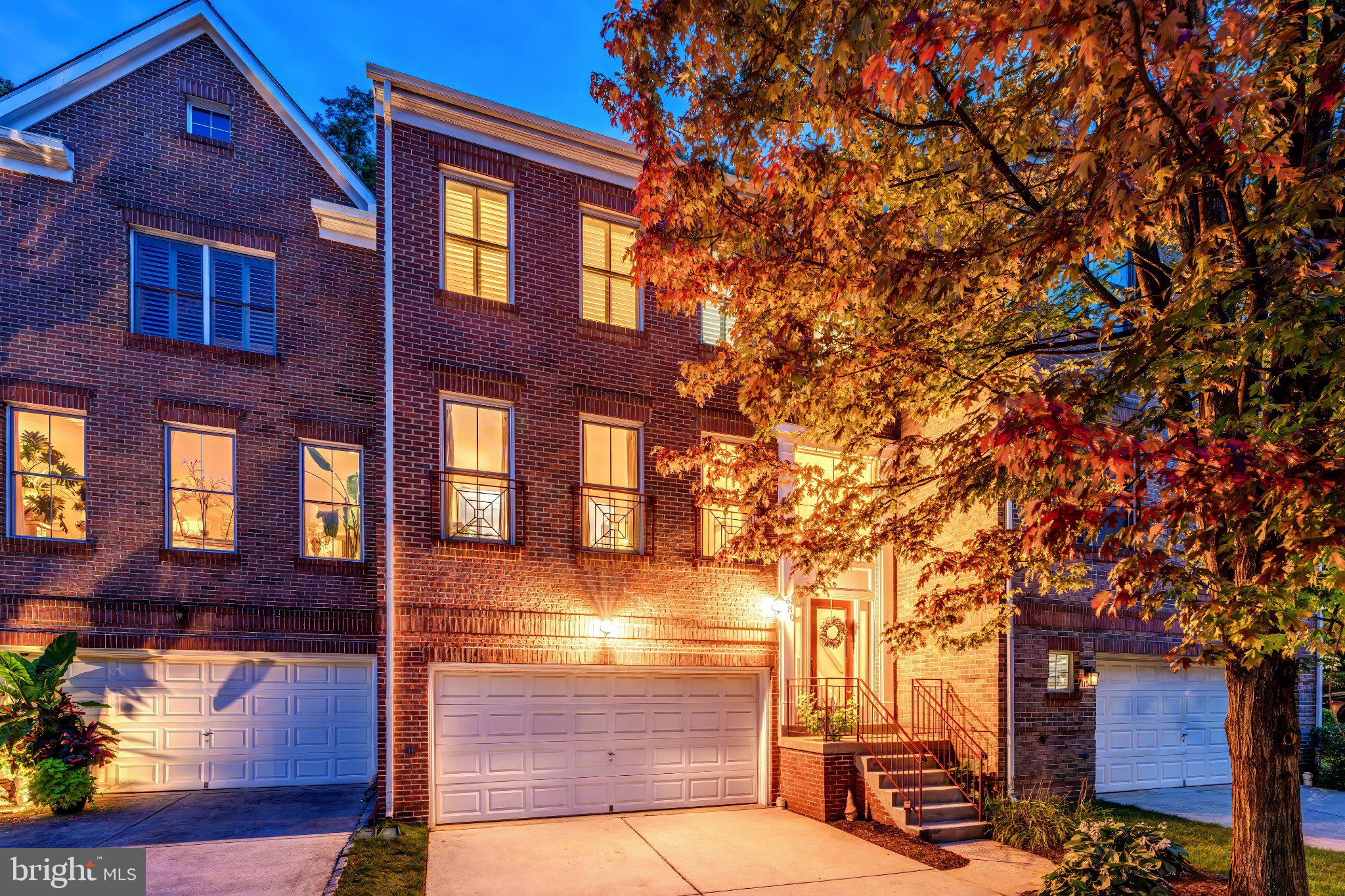 Life is built around a home like this for the way it welcomes people in, and I hope it does the same for you. Tucked into a small enclave off the through streets in North Reston, this brick front townhome with a two car garage sits close enough to walk to Reston Town Center and Lake Anne Plaza for dinner or coffee, and just as close to the neighborhood pool, tennis and pickleball courts, rec area, and playground, with the metro only five minutes away. Downstairs, the lower level opens into a large rec room anchored by a gas fireplace with a mantle, along with a half bath, a storage closet, and a laundry closet with front load machines that we updated in 2020 to a steam washer and dryer set. On the main level, the formal dining room sits under a chandelier we loved picking out, paired with an equally spacious formal living room, both filled with light, while the kitchen was renovated with 42 inch cabinets and soft close storage in 2019, quartz counters, large format tile, a slide in gas range, built in microwave, and a French door refrigerator, with a Bosch dishwasher and KitchenAid refrigerator added in 2024 and 2022 that convey with the home, plus a pantry and an eat in breakfast area that flows into the family room, where a second gas fireplace, built ins, recessed lighting, and an oversized slider with three window panels (replaced in 2017 along with the windows) let the backyard feel like part of the room. Upstairs, three generous bedrooms each have overhead lighting and ceiling fans, including a primary suite with a vaulted ceiling and a custom organized walk in closet we had built out in 2020 with smooth glide racks and long hanging space, plus a primary bath with a seamless glass shower enclosure, on trend tile, a soaking tub, and dual vanities, while the two remaining bedrooms share a nicely appointed secondary bath. Outside, the fully fenced backyard has both a deck and a patio for however you like to spend an evening, and there is plenty of visitor parking for when friends come by. We also kept up with the bones of the house over the years: plantation shutters throughout in 2019, a new roof in 2022, and in 2025 a full Michael & Son Clean Air Package added to the dual HVAC system, with in-duct UV and oxidizing sterilization and direct-coil UV light on the cooling coil, so the air moving through this home is genuinely some of the cleanest you'll find. This location, this layout, this level of care, it all comes together here, and we're excited for someone new to take it forward. As part of Reston Association, residents enjoy access to 15 pools, 55 miles of trails, numerous parks, 4 beautiful lakes, 52 tennis courts, 18 pickle ball courts, a variety of community events and programs throughout the year including festivals, concerts, workshops, and social gatherings, plus several community centers including the Reston Association headquarters, Walker Nature Center, and the Lake House at Lake Newport, which offer space for meetings, classes, and special events.