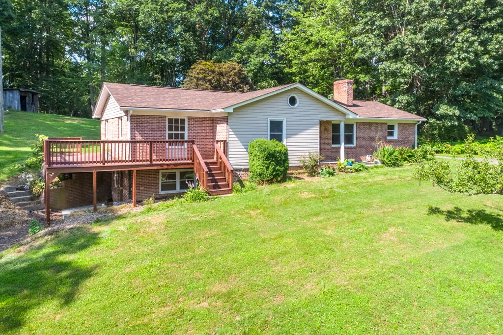 Welcome to your dream home in the heart of beautiful Independence, VA! Nestled on a spacious 0.81-acre lot, this meticulously maintained 3-bedroom, 3-bath home offers 1,797 square feet of thoughtfully designed living space. Recent updates provide peace of mind for years to come, including a brand-new roof , new HVAC system (August 2023), well pump (May 2022), septic clean-out (June 2024), new basement windows , and a resurfaced basement patio (both April 2025). Inside, you'll find timeless elegance with tile and oak hardwood flooring throughout the home. The kitchen is a chef's delight, featuring Whirlpool Gold appliances, a custom rock maple pantry, and ample space for preparing farm-fresh meals from the nearby Independence Farmers Market—just 1.5 miles away. Relax in the cozy living area, complete with a stunning custom cherry fireplace, perfect for cool mountain evenings. The property's yard is a rare gem, providing plenty of space for gardening, outdoor entertaining, or simply soaking in the peaceful surroundings. Independence itself is a hidden treasure, rich in small-town charm and natural beauty. Stroll through historic Main Street to explore local shops, restaurants, and seasonal festivals that celebrate the town's deep Appalachian roots.  Outdoor enthusiasts will love the quick access to nearby Peach Bottom Falls, where you can enjoy the serene sounds of cascading water and scenic hiking trails. Grayson County is known for its vibrant music heritage, stunning mountain landscapes, and welcoming community spirit. Living here means enjoying the best of rural tranquility while being surrounded by the majestic beauty of the Blue Ridge Highlands. Don't miss this opportunity to own a home where modern updates meet the timeless beauty of Southwest Virginia. Whether you're looking for a full-time residence or a mountain getaway, this property is ready to welcome you home. Schedule your private tour today and start your next chapter in Independence!
