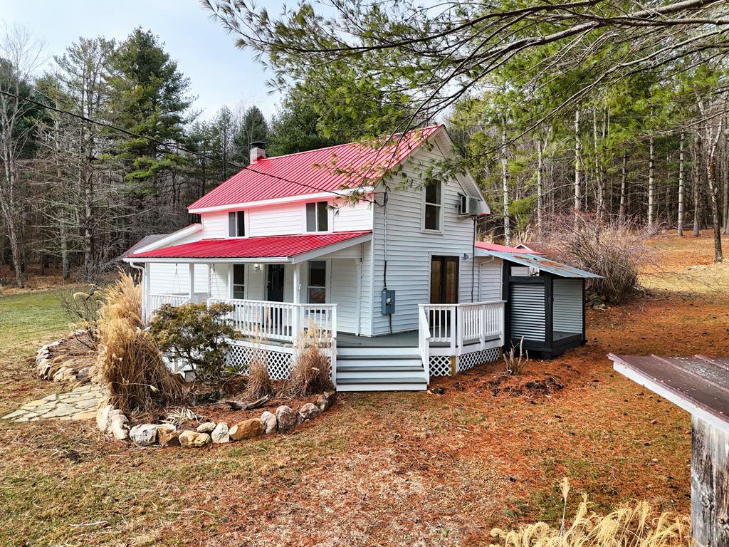 Enjoy country living in this Farmhouse with a covered front porch, situated on 4.21 acres with a log outbuilding, log springhouse, firepit and stone root cellar building. Hardwood floors throughout most of the home, new terra cotta flue with an electric fireplace insert. Some new Plex plumbing installed and 3 mini split heating units installed in 2025. Jetted tub and new vanity in the beautifully updated bathroom. This charming home has two bedrooms on the main level, and the entire upper-level loft can be used as a third bedroom. Call for a private showing today!