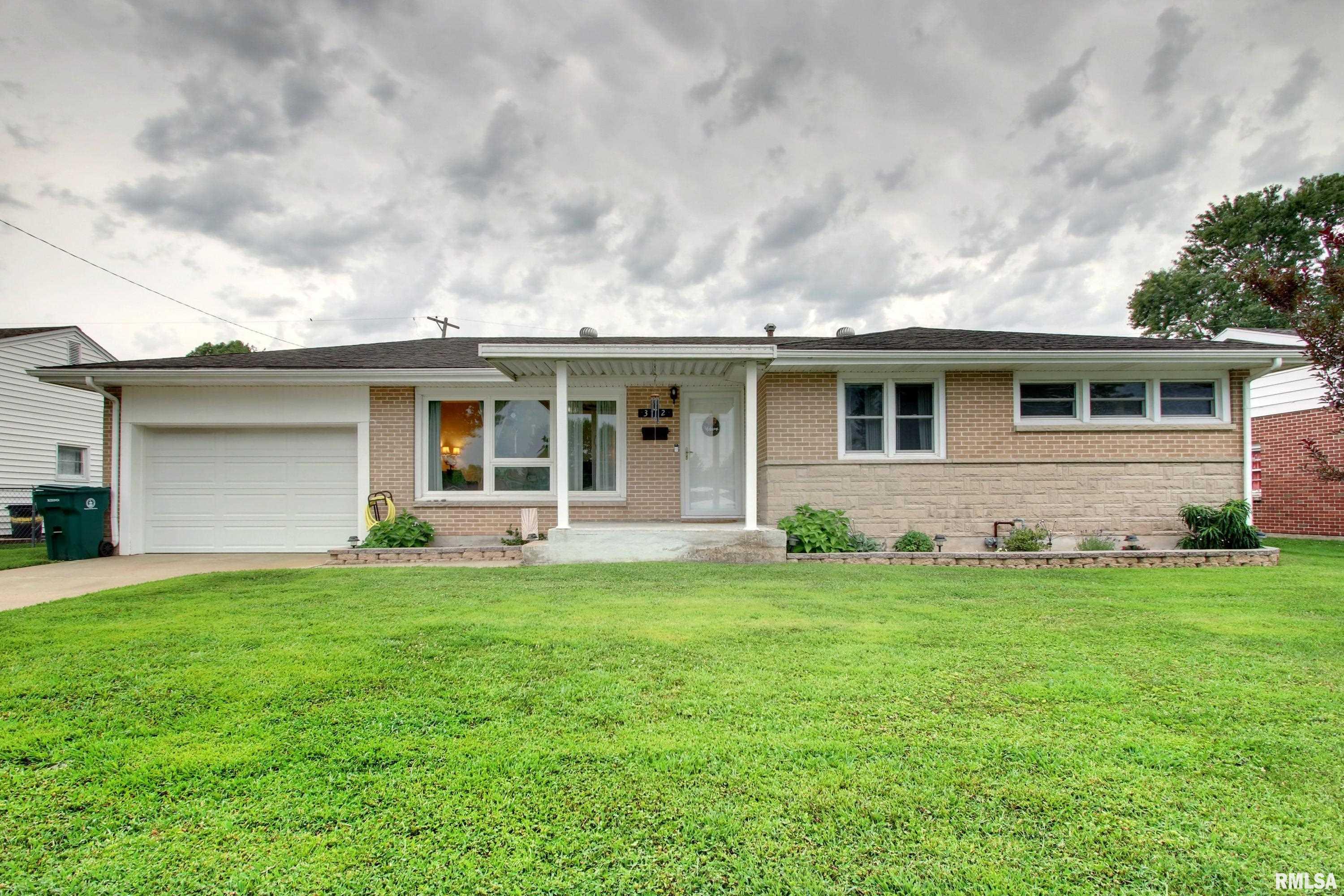This beautiful brick home has been meticulously maintained and is move-in ready.  With three bedrooms, two full baths and a room in the basement that has been used as a fourth bedroom (no egress, but two daylight windows) this home has so much to offer.  The eat in kitchen is spacious with updated kitchen cabinets and tile floors.  The main floor has beautiful hardwood floors in the living room, hall and bedrooms. Replacement windows are throughout the home and are beautiful and in great shape. The basement has a large finished room that is the perfect hang out space and an egress window for peace of mind.  The yard is private with a concrete patio and fencing.  This home offers so much for such a reasonable price point!  Call to schedule your showing today.