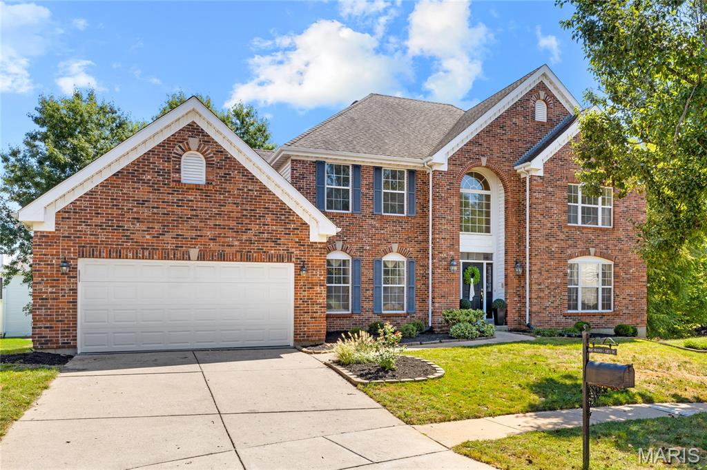 Classic-styled brick 2-story in sought-after Nooning Tree. This popular “Belmont” model from McBride Homes features well-proportioned rooms, freshly painted interiors, new carpeting, refinished oak hardwoods, and detailed trim work throughout. Full-height Palladian windows fill the home with an abundance of natural light. An impressive 2-story entry foyer leads to formal living and dining rooms and a spacious family room with a wide bay window, marble fireplace, and built-in bookcases. The chef’s kitchen features 42” cherry cabinetry, a butterfly center island, and ample workspace, adjoining a light-filled breakfast room with a convenient planning center. The T-staircase accesses the luxurious primary bedroom suite, complete with two walk-in closets and a spa-like bath featuring a jetted tub. Three generous additional bedrooms include one with an ensuite bath and two sharing a Jack-and-Jill bath, providing comfortable and versatile second-floor living. The walk-out lower level offers a private office and abundant storage space. Sliding glass doors open to an exceptional outdoor living area featuring a composite deck, second pool deck, and covered patio—perfect for relaxing or entertaining. Conveniently located in Chesterfield, just minutes from shopping and restaurants with easy access to Highway 40. Historic Faust Park, with its walking trails, carousel, and Butterfly House, is only steps away.