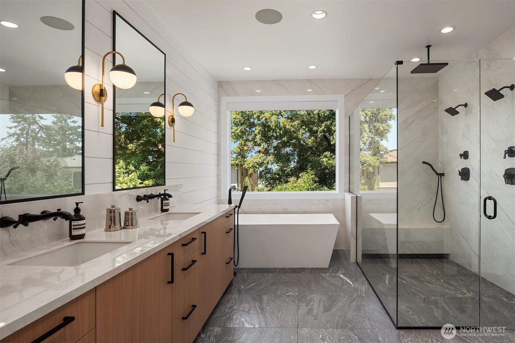 Spa-like primary bath with soaking tub and walk-in shower