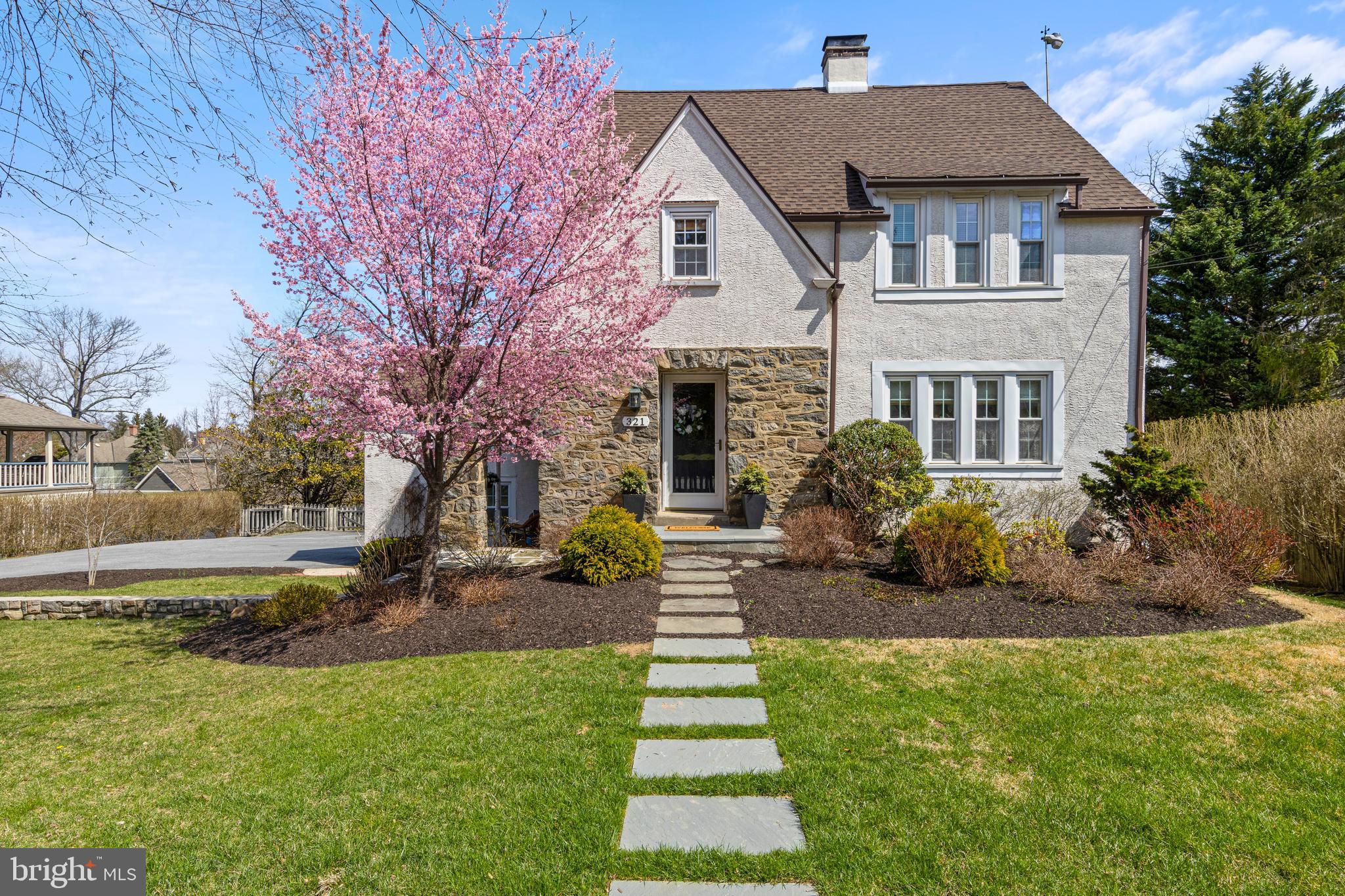 Ideally located just moments from the heart of Wayne, this beautifully updated 4-5 bedroom 3.5 bathroom, turnkey home blends timeless charm with modern convenience. Enjoy effortless access to boutique shopping, top-rated restaurants, the train, parks, and the Radnor Trail—all just a short distance from your front door.Set on a flat, fenced-in lot, the property features a spacious backyard complete with a deck and patio—perfect for outdoor entertaining and everyday enjoyment.From the moment you arrive, the home’s classic curb appeal and inviting character make a lasting impression. Inside, a thoughtfully updated interior showcases hardwood floors, elegant architectural details, and sun-filled living spaces designed for today’s lifestyle. The seamless layout offers an ideal balance for both comfortable living and entertaining.The beautifully renovated kitchen serves as the heart of the home, featuring modern finishes, stainless steel appliances including a Wolf range and steam oven, with direct access to indoor and outdoor gathering spaces. Multiple living areas provide flexibility for a family room, home office, or playroom, while the sunroom adds a bright and cheerful retreat.Upstairs, the bedrooms offer comfort and privacy, including an ensuite with a sitting room currently used as a home gym. A fully finished third floor provides additional versatile space for guests, work, or a potential primary suite as it has its own full bathroom.Additional highlights include two garages and off-street parking for up to five cars.With its prime location, classic charm, and extensive updates, this home offers the perfect combination of character, convenience, and move-in ready living—all within the award-winning Radnor School District.