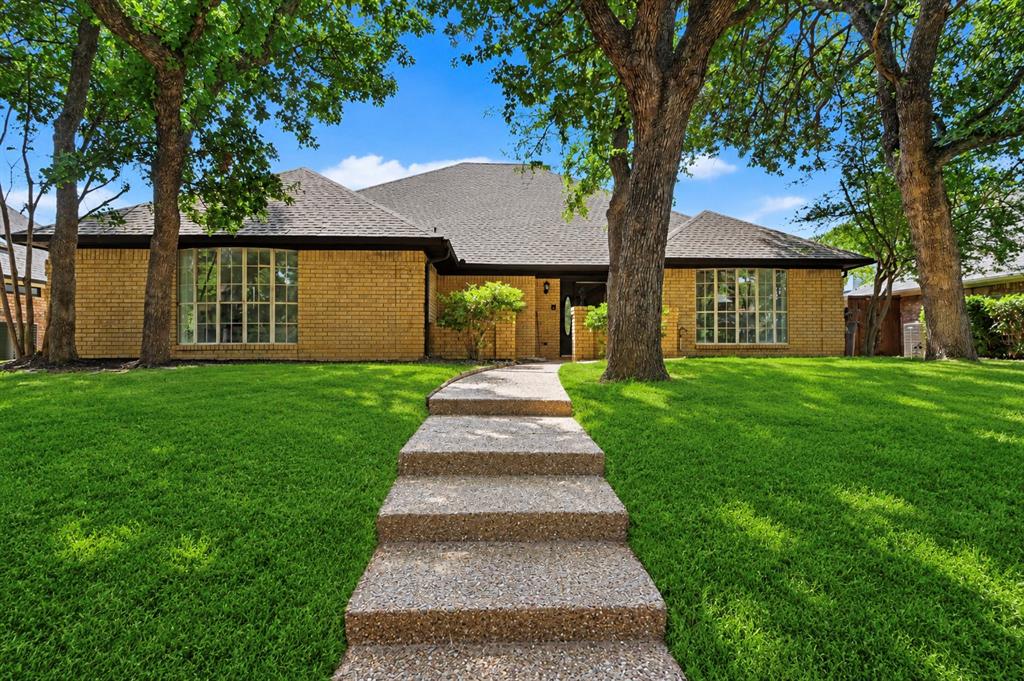 Set beneath a canopy of mature trees, this beautifully refreshed Arlington home blends timeless character with thoughtful updates and exceptional indoor-outdoor living. Dramatic vaulted ceilings, exposed wood beams, abundant natural light, and a striking brick fireplace create warm, inviting living spaces with distinctive architectural charm.The spacious kitchen features quartz countertops, extensive cabinetry, updated fixtures, and new appliances. Fresh interior paint, new carpet, and double-pane windows enhance the home’s bright, refreshed, and move-in-ready feel.The private primary retreat is thoughtfully separated from the secondary bedrooms and complemented by an updated bath featuring dual vanities, a freestanding soaking tub, separate shower, and generous storage. Additional flexible spaces offer plenty of room for a home office, guests, or hobbies.Designed for entertaining inside and out, the enclosed patio opens to a backyard retreat featuring a sparkling pool, expansive deck, and mature shade trees. Conveniently located near Lake Arlington, shopping, dining, recreation, and major thoroughfares, this home offers an exceptional combination of character, comfort, thoughtful updates, and outdoor living.