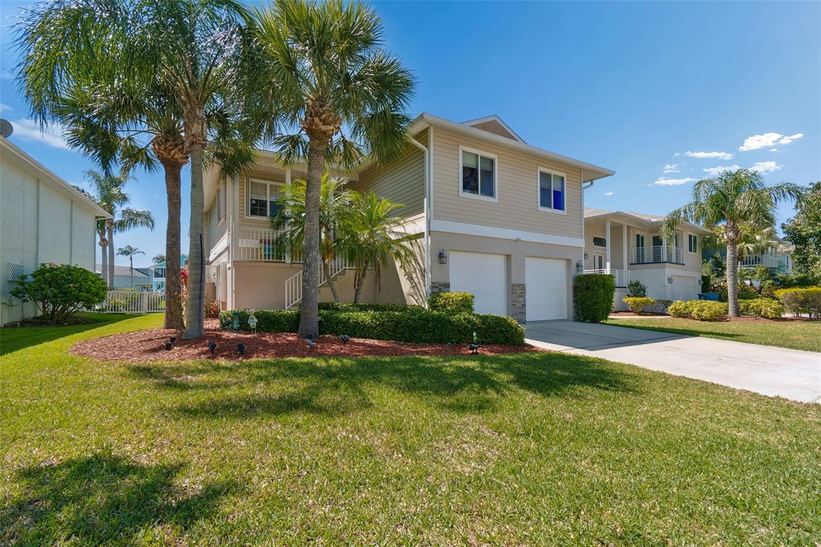 Waterfront living in the desirable Sea Forest community with direct Gulf access and no bridges. This elevated home offers a spacious 3 bedroom, 3 bathroom open floor plan upstairs with hardwood flooring throughout the main living areas, built-in entertainment center, skylights for natural light, and a separate dining space. Enjoy expensive water views from two screened porches, ideal for entertaining or unwinding. The home also features a chair lift for added accessibility between levels. The lower level includes a huge open space with full bathroom offering endless possibilities for recreation, guest quarters, or additional living area. Outdoor features include a 10,000 lb boat lift and quick access to open water, making this property ideal for boating enthusiasts. Sea Forest amenities include two heated pools, spa, sauna, tennis courts, clubhouse, private boat ramp, and private Gulf-front beach access with restrooms and picnic areas. A rare opportunity to own a waterfront home with space, flexibility, and direct Gulf access.