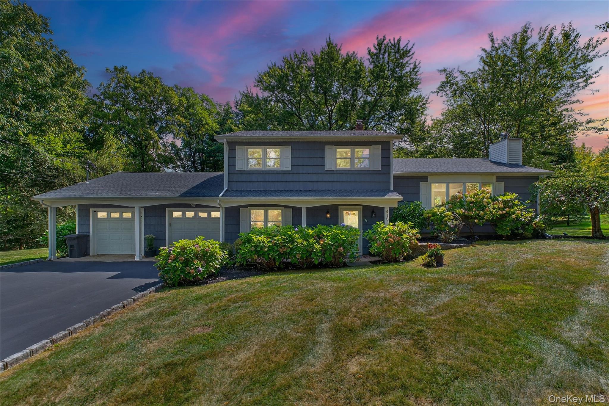 Welcome to your forever home, a blend of modern comfort and timeless style, perfectly tucked away on a serene cul-de-sac in one of Yorktown Heights' most coveted neighborhoods. This beautifully renovated 3-bedroom, 3-bathroom residence is a true sanctuary, offering an exquisite balance of sophisticated design and everyday functionality.

The heart of this home is a show-stopping kitchen with glimmering quartz countertops, sleek soft-close cabinets, and top-of-the-line stainless steel appliances. A grand kitchen island with seating invites casual conversation, while the space flows effortlessly into the dining area and an expansive 20’x20’ deck. This is more than a deck; it's your personal stage for al fresco dining and unforgettable gatherings, bathed in natural light and completely secluded by a backdrop of mature trees, ensuring a sense of ultimate privacy. 

Retreat to your private primary suite, a haven of relaxation complete with a generous walk-in closet and a ensuite bath featuring chic, modern finishes. Two additional sun-drenched bedrooms and a beautifully updated bathroom complete the main level, providing comfort and style for family and guests alike.

The journey continues to the spacious lower level, a vibrant hub for leisure and recreation. A large family room with French doors opens directly to a charming brick patio and the lush backyard, blurring the lines between indoor and outdoor living. This level also includes a full bathroom, a convenient laundry room, and a mudroom with ample storage, leading to a rare find: a heated 2-car garage, offering warmth and convenience year-round.

Thoughtful touches abound, including the comfort of central air, the intelligence of a Nest Smart-thermostat, the classic elegance of gleaming hardwood floors, and the peace of mind that comes with a roof that's just two years young. This isn't just a house; it’s a lifestyle, a meticulously updated, move-in-ready gem that promises the perfect blend of modern luxury and blissful convenience in an unbeatable location. Taxes do not reflect additional STAR Savings of $1678.76.