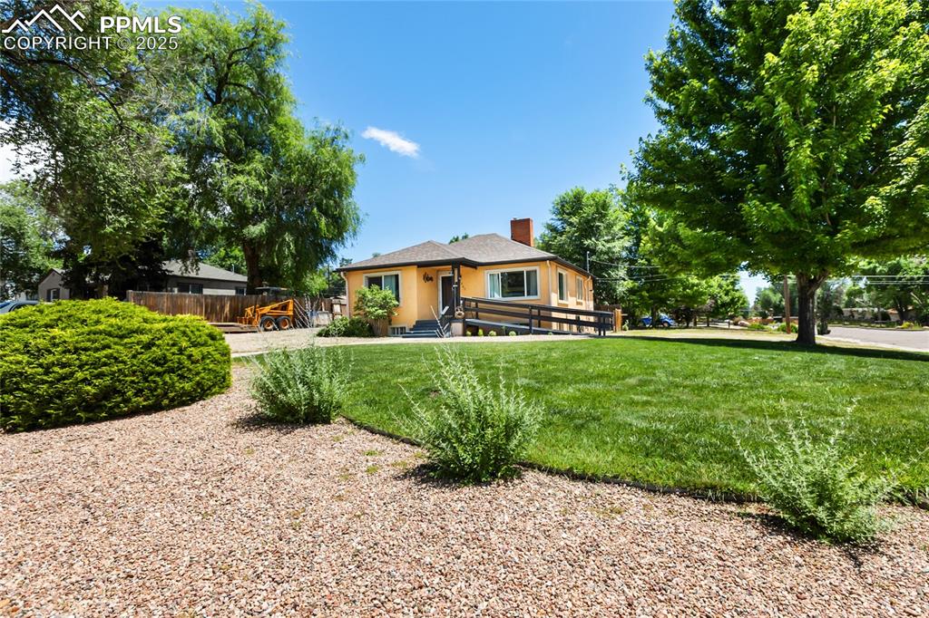 Vintage Charm with a View – 1945 Gem in the Heart of Colorado Springs!

Step into a piece of history with this one-of-a-kind 1945 ranch-style beauty, perfectly perched on a corner lot with breathtaking, unobstructed views of Pikes Peak right from your front door. Nestled in the heart of Colorado Springs, this home is a rare find—blending character, convenience, and charm in one unforgettable package.

With 2 bedrooms and 1 bath on the main level, you’ll love the warmth of original details and the cozy, timeless layout. Downstairs, a finished basement apartment offers flexibility for multi-generational living or rental income potential—complete with its own washer, dryer, refrigerator, and range/oven. That's two complete living spaces, each with its own set of essentials!

The beautifully landscaped front yard features mature trees—including your very own maple—and invites you to relax and soak in the mountain view from your porch swing or patio chair.

Whether you're a lover of vintage homes or simply searching for something with soul, this home delivers. Don’t miss the chance to own a classic with a view—this darling is ready for its next chapter!