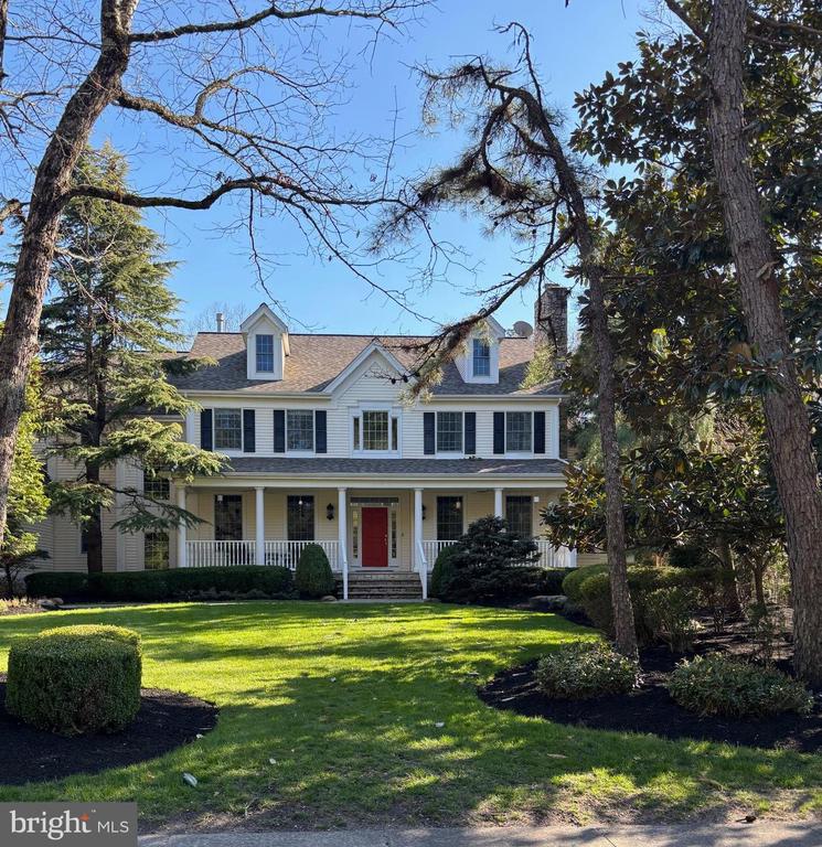 WELCOME TO YOUR NEXT HOME! Custom built Gary Gardner home nestled on a private wooded lot with lush landscaping and specimen plantings. This home features 5 bedrooms, one in the lower level with and egress window and a full steam/shower bath,  perfect for the au pair, guest or in-law. There are 5 1/2 baths, 3 gas fireplaces (one can be used as a wood burner), playroom, office/music room w/Hunter Douglas room darkening silhouettes,  3 car side entry garage and wine cellar.  Upon entering the home, you step onto the veranda with aggregate concrete floor, porch swing and 2 ceiling fans, it is the perfect place for peace and quiet! The 2 story foyer invites you to this well appointed, open floor plan with many upgrades and recent improvements in the kitchen, familly room and breakfast room area with an elegant Italian chandelier by Viticcio. The owners have recently invested over $400,000 in the upgrades with the help of the award winning decorator Nicole Lorber from "Distinctive Interior Design" including  a gorgeous main bedroom suite which includes a beverage center, Elica refrigerator, custom reading lights over the bed and a mounted TV. The state of the art bath that includes a sliding barn door that opens to an oversized walk-in shower with pebble shower floor, radiant heated ceramic designer floor, heated towel rack, custom crystal lighting and ultramodern floating vanities. The kitchen has a custom fireplace with imported ceramic surround, Brookwood cabinetry,  5 burner Thermador gas countertop with retractable downdraft system, 2 GE ovens,  Asko dishwasher, GE refrigrator, wine refrigerator, farmer sink and an oversized island with Quartz white counters. The family room and kitchen looks out to the back pergola covered porch with 2 Infratech heaters and 2 ceiling fans, stone bar with 4 burner grill and the infamous Evo grill. The parklike rear garden has an updated, resurfaced salt water inground pool with spa and bluestone surround, extensive hardscaping, meditation area, stone and black glass conversation fire pit, exterior speakers, irrigation system, fenced dog run and fenced yard backing to woods. To the side of the property, there  a walkway leading to the lake area. This home has so many extra features: Jack and Jill bedroom with laundry chute, recessed lighting, ceiling fans throughout, hardwood floors throughout, with engineered floors in the lower level, custom window treatments,  plantation shutters and a hanging pendulum chandelier in the dining room, skylights, crown molding on the first floor,  programmable thermostat, whole house fan, Christmas lighting package, security system and Ring,  new 50 year, architectural roof and solar panels that are owned,  reducing the electric bill tremendously! Public water and private septic.  One year home warranty included. Don't miss this opportunity to see and own  beautiful home. This will not last!     (   Professional photos, video and aerials coming on 4/17/2026  )