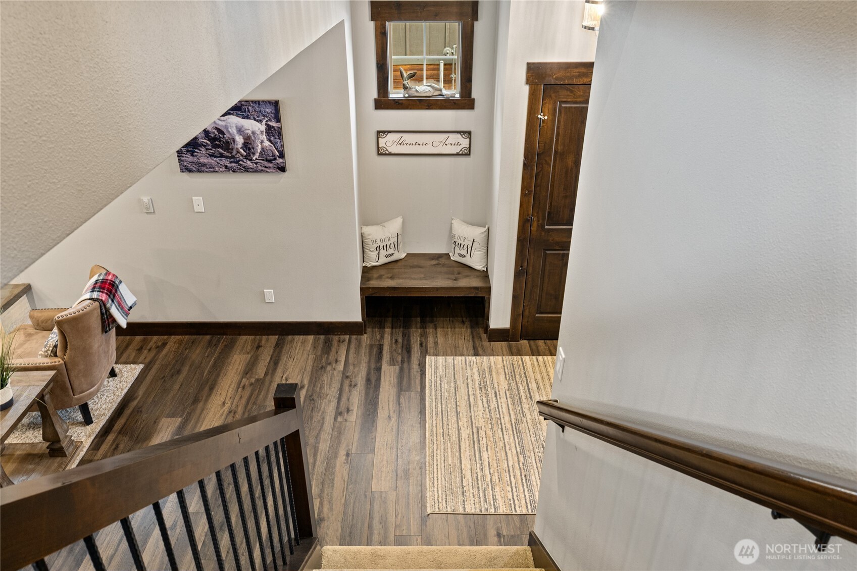 Looking down the stairs to main floor. Little built in seat