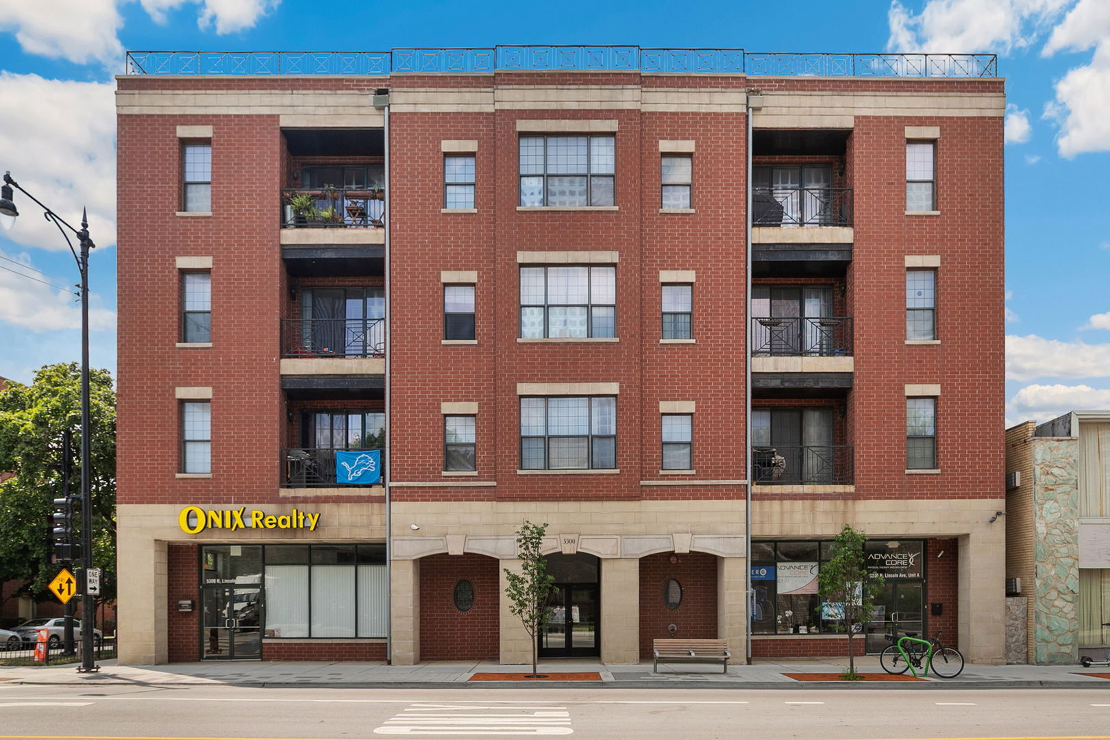 Stunning and fully updated 2 bed, 2 bath condo in a boutique elevator building. Renovated in 2023, this home features a desirable split-bedroom floor plan, hardwood floors throughout, and a spacious open-concept living and dining area that flows to a private balcony. The show-stopping kitchen offers a waterfall peninsula with breakfast bar, sleek black subway tile backsplash, white cabinetry, open shelving, and stainless steel appliances. The primary suite includes a large walk-in closet and a spa-like en suite bath with dual vanity, soaking tub, and walk-in shower. The second bedroom is generously sized with a large closet and adjacent to a fully updated bath with a floating vanity and glass walk-in shower with rainfall showerhead. Additional features include new recessed lighting (2023), in-unit laundry, one garage parking space, and a brand-new roof in 2024. Ideally located just seconds from Tony's Fresh Market and blocks to the Foster and Western buses & beautiful Winnemac Park. Enjoy being just minutes from the vibrant shopping and dining scenes of both Andersonville's Clark Street and Lincoln Square, and only 25 minutes from O'Hare. A truly turnkey home in a prime location!