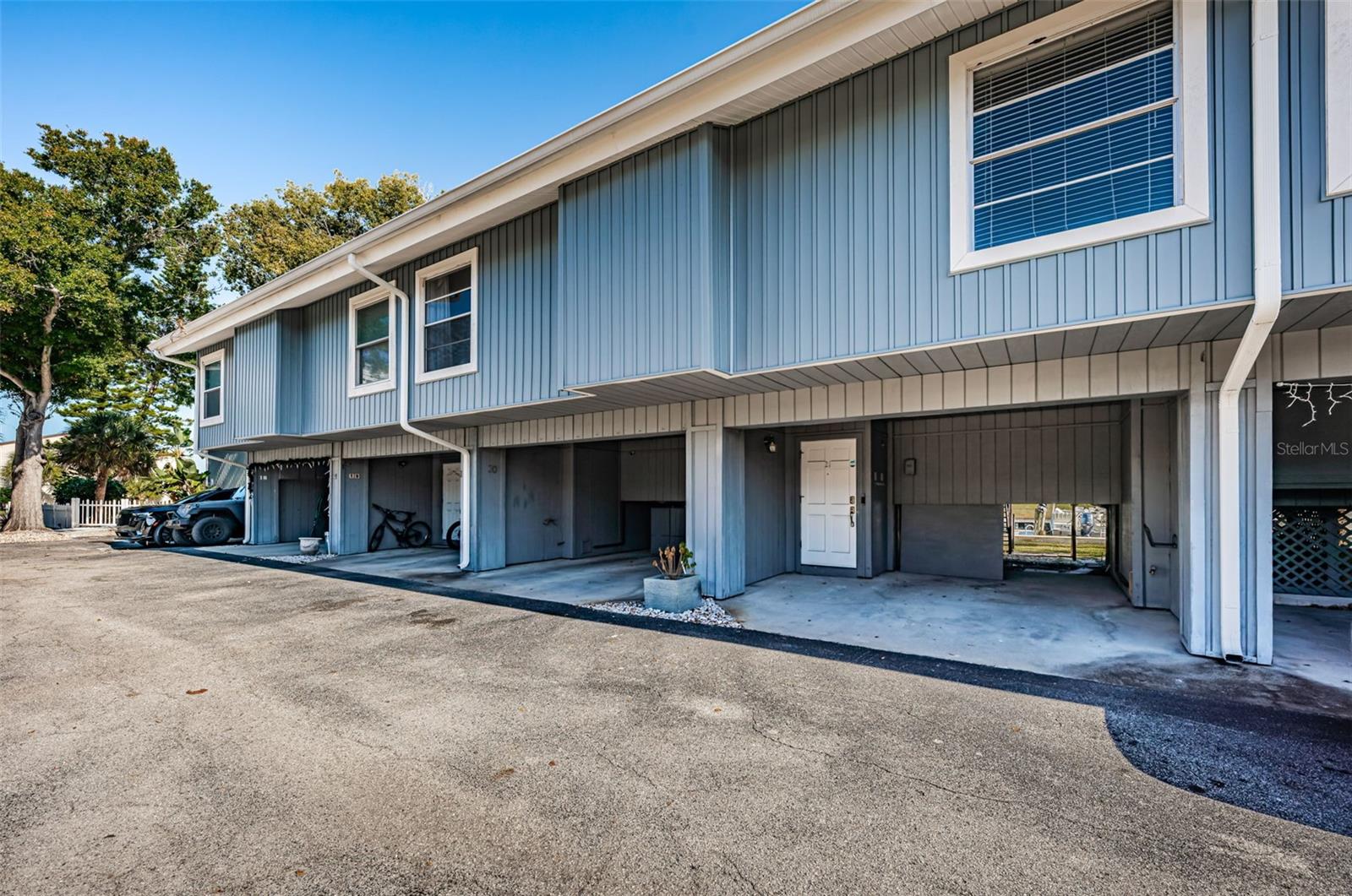 This waterfront townhome is priced to sell and ready for you to make it your own—complete with a deeded boat dock just steps from your back door. Store your boat out back and cruise to nearby waterfront restaurants or head out to the Gulf for fishing and days in the sun. Ideally located near shopping and dining, this home is also just minutes from the famous Sponge Docks and historic downtown Tarpon Springs.The townhome features updates throughout. The first floor features a spacious kitchen and an open living area, complete with luxury vinyl flooring and a balcony overlooking the canal, perfect for relaxing and taking in the water views. The second floor features a guest bedroom and full bath, while the third floor is reserved for the primary suite, complete with its own private balcony offering serene waterfront views and sunsets.The marina community is conveniently located just 22 miles from Tampa International Airport, 16 miles from award-winning Clearwater Beach, 4 miles from Fred Howard Park, 6 miles from vibrant downtown Dunedin, and 4 miles from Honeymoon Island. Residents enjoy access to a clubhouse and waterfront pool, ideal for relaxing and unwinding.The HOA fee provides truly stress-free living and covers flood insurance, grounds maintenance, exterior maintenance, pest control, water, sewer, trash, cable, and use of the pool and clubhouse.