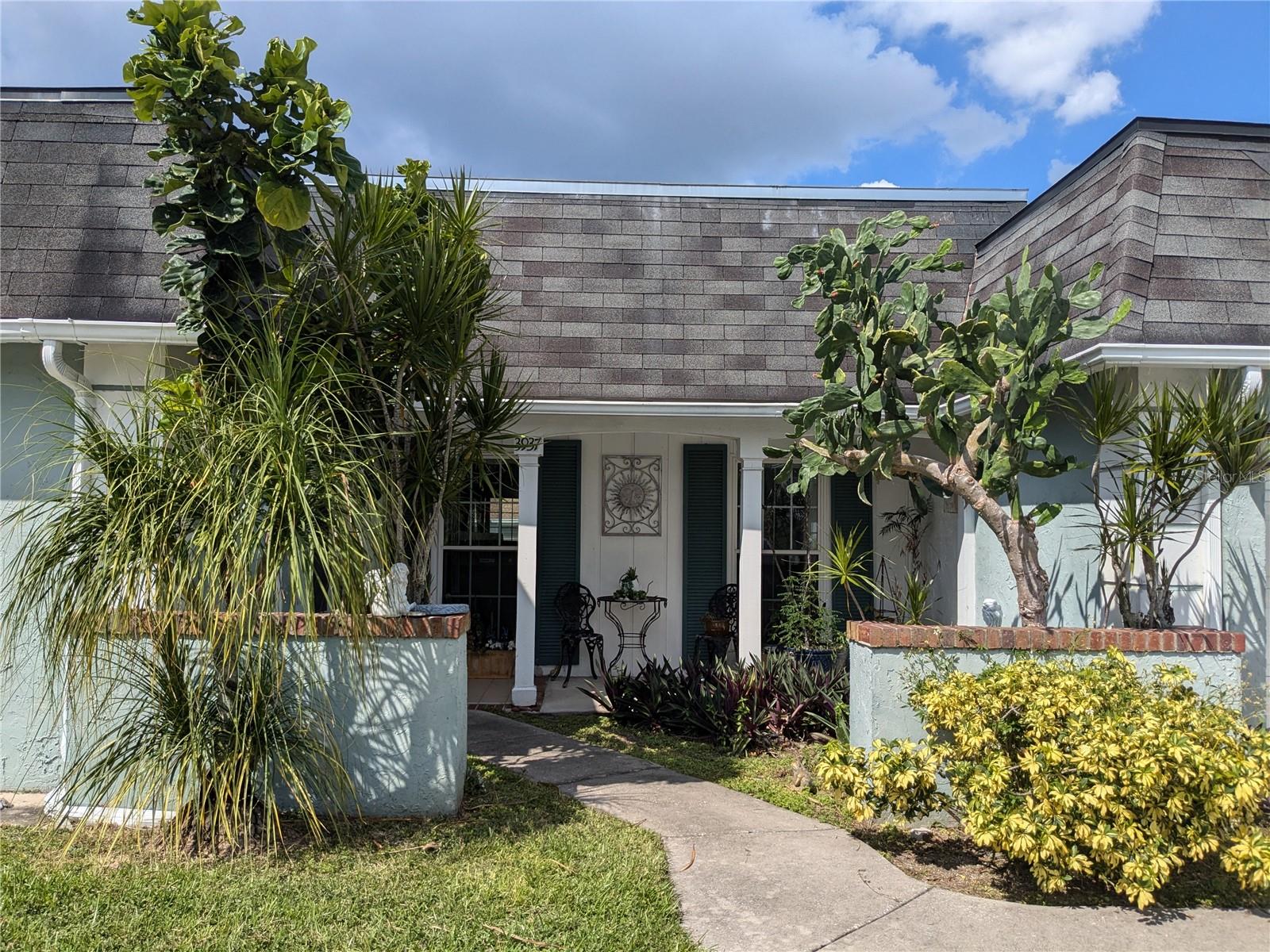This won't last long at $230,000. LIKE WILDLIFE? Wonderful location for this large 2/2/1 on canal. Adorable front porch faces south. All tile or laminate throughout. Large eat-in kitchen. Living room has rare coat closet. Family room is an extension of living room and can easily be made into 3rd bedroom. Large dining room has windows overlooking front drive. Both bedrooms have walk-in closets, main bedroom has ensuite bath with glass shower enclosure, hall bath has tub. Sliders from kitchen and Family room access Florida Room that has ceramic tile, vinyl windows, A/C, side entry, view of fenced yard and canal. Entire New roof 10/30/2025, newer AC. Windows replaced in 2005. Kitchen has refrigerator, glass top range, dishwasher, microwave, ceiling fans, garbage disposal. Extra wide driveway with attached garage and circular drive allow for multiple vehicles. All age community. Community center across the street  (separate fee to join) has all-season pool, clubhouse, playground, activities, etc. Close to US Hwy 19 N and public transportation, plenty of shopping and restaurants. Just minutes from Gulf access and fishing pier, beach and dog park at Anclote Park. Many other nearby beaches, golf courses and plenty of other things to keep you busy. Currently occupied by tenants. Please don't disturb them, call or text only, to view by appointment. Property is listed by owner who is a Licensed Realtor in Florida
