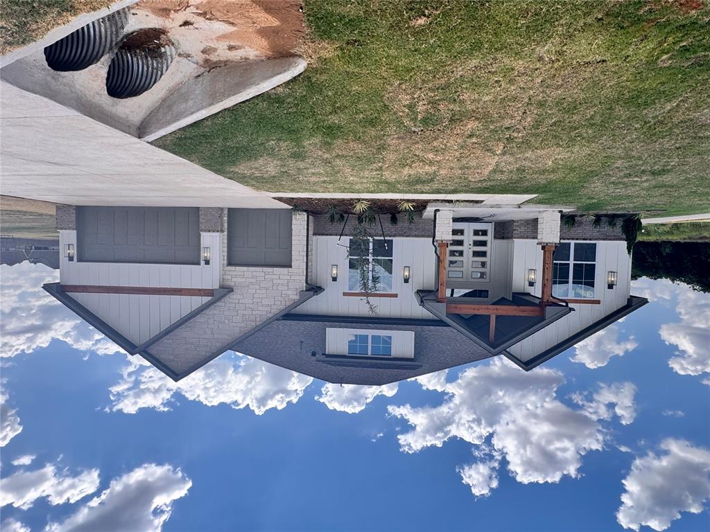 Modern Luxury with Tornado Safety – Blue Ridge Estates | Completion June 2026 Be among the first to own this stunning new construction home in Blue Ridge Estates, scheduled for completion in June 2026. Located on a spacious 0.68-acre (mol) corner lot, this 4-bedroom, 3.5-bathroom home offers over 3,000 sqft (mol) of thoughtfully designed living space. The exterior blends modern and traditional architecture with wood accents, stone columns, and a welcoming covered porch. Inside, enjoy light-filled interiors, energy-efficient Low-E windows, and high-end finishes throughout. The 3-car garage features sleek epoxy floors, and the large covered back patio is perfect for entertaining or relaxing outdoors. Built with tornado safety in mind, this home includes anchor bolts, tornado straps, and OSB sheathing for added structural integrity and peace of mind. With style, safety, and space in a prime location, this home offers everything you’ve been looking for.