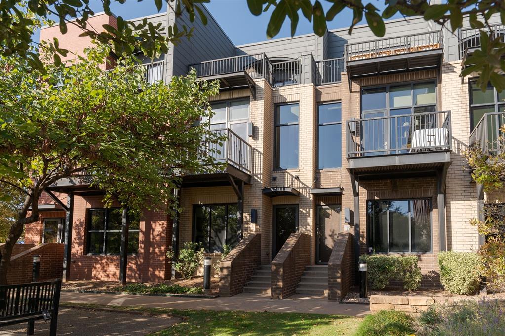 Welcome to Block 42, where urban living meets true walkability! Situated in the heart of Deep Deuce, this tri-level townhome offers easy access to all the excitement of Downtown OKC, including restaurants in its immediate vicinity, Bricktown, Automobile Alley and the Oklahoma River. Whether walking to local dining, shopping, or recreation, or enjoying quick access to I-235 and I-35, the location is ideal for work and play. As Downtown OKC's first LEED-certified development, Block 42 is designed for luxurious, environmentally friendly living. This townhome offers a low-maintenance, lock-and-go lifestyle perfect for busy professionals or those looking to enjoy the best of OKC. Entering the ground floor via private entry, you'll find a guest suite with ensuite bath. Second floor boasts a spacious living area with soaring 10' ceilings and floor-to-ceiling windows that flood the space with natural light. An open layout connects the living room to the dining area and kitchen, creating an inviting atmosphere for entertaining. The sleek kitchen features a breakfast bar, stainless appliances, with Jenn-Air gas convection range, quartz countertops, walk-in pantry and downtown views. Step out on the adjacent balcony for fresh air. Third floor primary suite offers a large closet, convenient laundry space, ensuite bath, reading nook or work-from-home office area, and access to the expansive third-floor patio—ideal for relaxing or entertaining. Additional features include wood floors on 2nd and 3rd levels, dual-zoned HVAC (one unit replaced 2022), new roof (2023), and 220V outlet in the attached garage for an EV. The home also includes an additional covered carport for added convenience. HOA includes property insurance (Buyer carries a contents/liability policy), exterior maintenance, landscaping, irrigation, natural gas, water, sewer and trash. Whether working downtown or seeking a stylish, sustainable, and convenient home, this townhome offers all for a quality urban lifestyle.