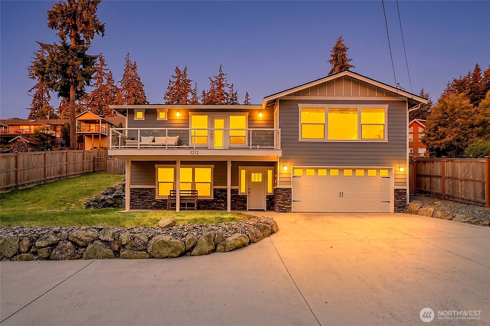 Enjoy sunrise views from this beautifully maintained 2022 custom-built home in Camano's expansive and enriching Country Club neighborhood. Located on Camano's east side, this home offers peekaboo water and mountain views, vaulted ceilings, and an open kitchen/great room featuring expanded counters, enhanced storage, dark cabinetry, a mosaic tile backsplash, and a dedicated coffee station. The main-level primary suite boasts a spa-inspired bath, two walk-in closets, and deck access, alongside a guest bedroom and full bath. Convenient main-floor access through the back door adds everyday functionality. The lower level includes an additional bedroom or office, bath, and bonus room. Outside, enjoy a fully fenced backyard, extra-deep garage, generous storage, and RV parking. Beach rights to three private beaches are included, with low homeowner dues. Optional clubhouse membership is available. Furnishings may be included if desired, offering a turnkey opportunity. No ferry—easy bridge access to island living! Seller offering $10,000 toward buyer’s closing costs, or rate buy down!
