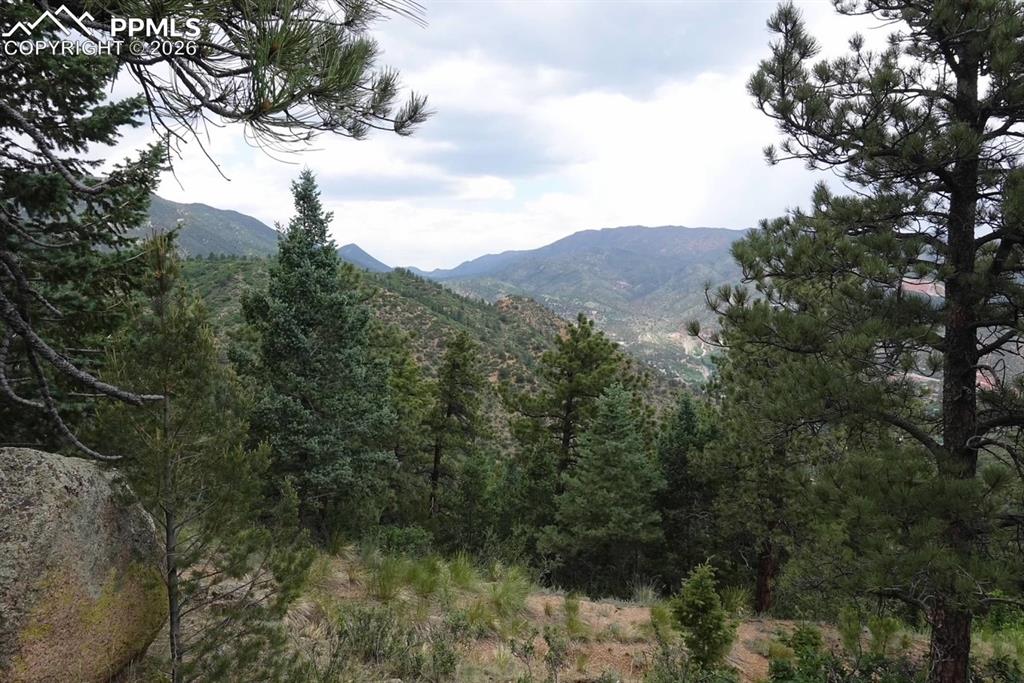 Have you ever dreamed of living in the mountains while still being in close proximity to the city? Well, we have a great land listing for you! This breathtaking piece of land is less than 3 miles from the gatehouse in beautiful Crystal Park, up in Manitou Springs Colorado. It is less than 25 minutes from downtown Colorado Springs, and has about 270 degrees of unobstructed views of Manitou, Cave of the Winds, Ute Pass, Garden of the Gods, Downtown Colorado Springs, all the way to the windmills in Callahan! It is one of the most ideal lots for building in all of Crystal Park. Absolutely stunning! Come take a look and you will fall in love. Beautiful forested private lot in the Middle Park ~ at the end of quiet dead end street ~ Street ends right now atthe driveway of 1010, but will be extended when new buyer pulls a permit to build ~ Lot is mostly on the left & has a bigboulder ~ Beautiful city, mountain, Garden of the Gods views, Sloping with flatter building site. Electricity is nextdoor ~ lot is surveyed (see MLS attachments) Crystal Park is a safe gated community with pool, clubhouse,pickleball court, small playground, & trails throughout.