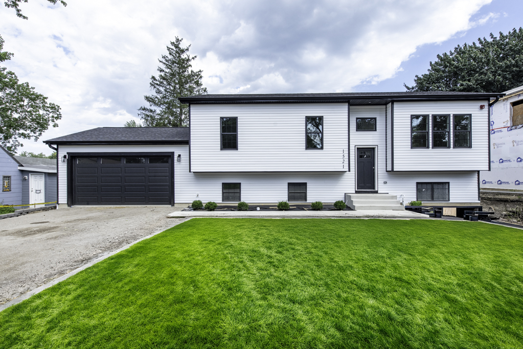 READY FOR OCCUPANCY! STUNNING NEW CONSTRUCTION IN ROUND LAKE BEACH - GRAYSLAKE SCHOOLS!    Welcome to this exceptional 5-bedroom, 3-full-bath new construction home, ideally located in Round Lake Beach and served by highly regarded Grayslake schools. Thoughtfully designed with modern style, quality finishes, and an open, functional floor plan, this home is truly move-in ready!    Step inside to an inviting open-concept living space featuring 9-foot ceilings on the first level and vaulted ceilings in the living room and kitchen, creating a bright and spacious atmosphere. The beautifully designed kitchen features quartz countertops, stainless steel appliances, a center island, and abundant cabinet and counter space, making it perfect for everyday living and entertaining.    The kitchen, living room, and dining area flow seamlessly together, with a patio door featuring built-in blinds between the glass providing easy access to the wood deck and spacious backyard. The huge family room offers plenty of room for gatherings, entertaining, or relaxing with family and friends.    The bathrooms feature beautiful ceramic tile finishes, adding a stylish and modern touch. Additional highlights include a washer and dryer, spray foam insulation, high-efficiency HVAC system, and tankless water heater, providing comfort and energy efficiency throughout the home.    The attached finished garage offers convenient parking and additional storage. Situated on a double lot, the property provides an abundance of outdoor space that is hard to find with new construction.    Modern design, spacious rooms, quality finishes, energy-efficient features, and a fantastic location come together to make this home a wonderful place to call your own.    A MUST SEE! Schedule your private showing today!