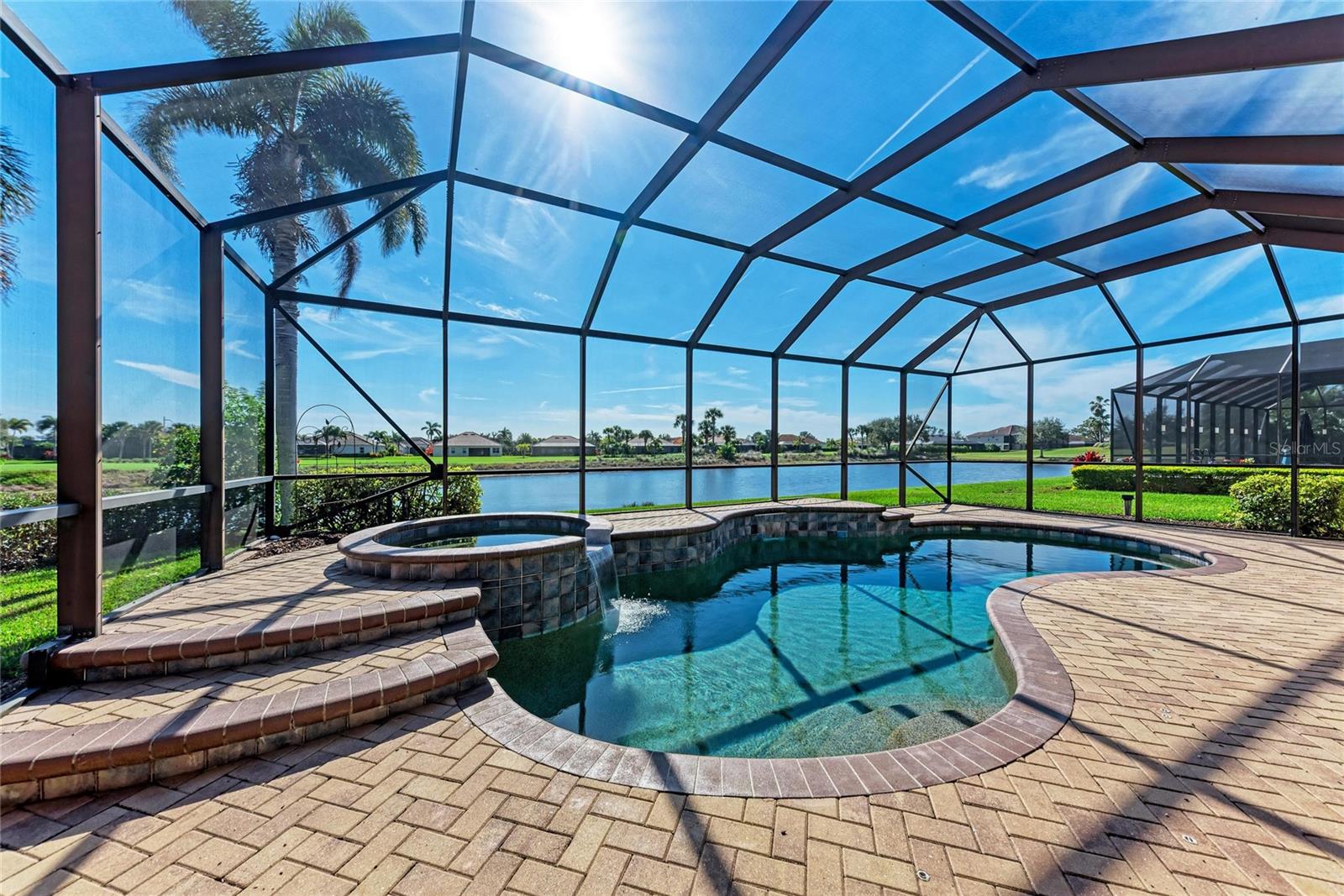 Sparkling water views and sunshine filled days are in your future if you make this beautiful home yours. Are you looking for a home that will fit all your family and friends or just need some extra space for an office, hobby room or a man cave? The fully furnished Sawgrass floor plan is the one for you. With four full bedrooms, three baths and an extra flex room, which can be a bedroom, office or den, this is the largest one-story floor plan offered in the golf-deed section of River Strand Golf and Country Club. The location offers stunning views out of the back, looking out to the south so you will have a lovely sunrise and sunset view on the pond in the backyard as well as the golfers at a safe distance on the other side of the pond. What’s not to love with all the space and a three-car garage, oh and did I mention the expansive lanai with your own private pool and spa? The outdoor area is truly an extension of your home and offers the best that Florida living has to offer, including a large, covered area in case you have a rainy day. This home has never been rented, and the original owners have lovingly maintained it so It is ready for you. Strand Golf & Country Club is a friendly community with a 27-hole Arthur Hills designed golf course, 9 Har-Tru Tennis Courts, 8 Pickleball courts, 2 Resort-Style Pools, 6 Satellite Pools, currently renovated Clubhouse set to open later this spring with a restaurant & social events, Community Center & 2 fitness centers in this luxury gated community with 24 hr. security & lawn maintenance.  Convenient location to I-75, Costco, Target, Hobby Lobby & more, University Town Center, & beaches complete the package.  River Strand Golf & Country Club More than a Community, It’s a Lifestyle.