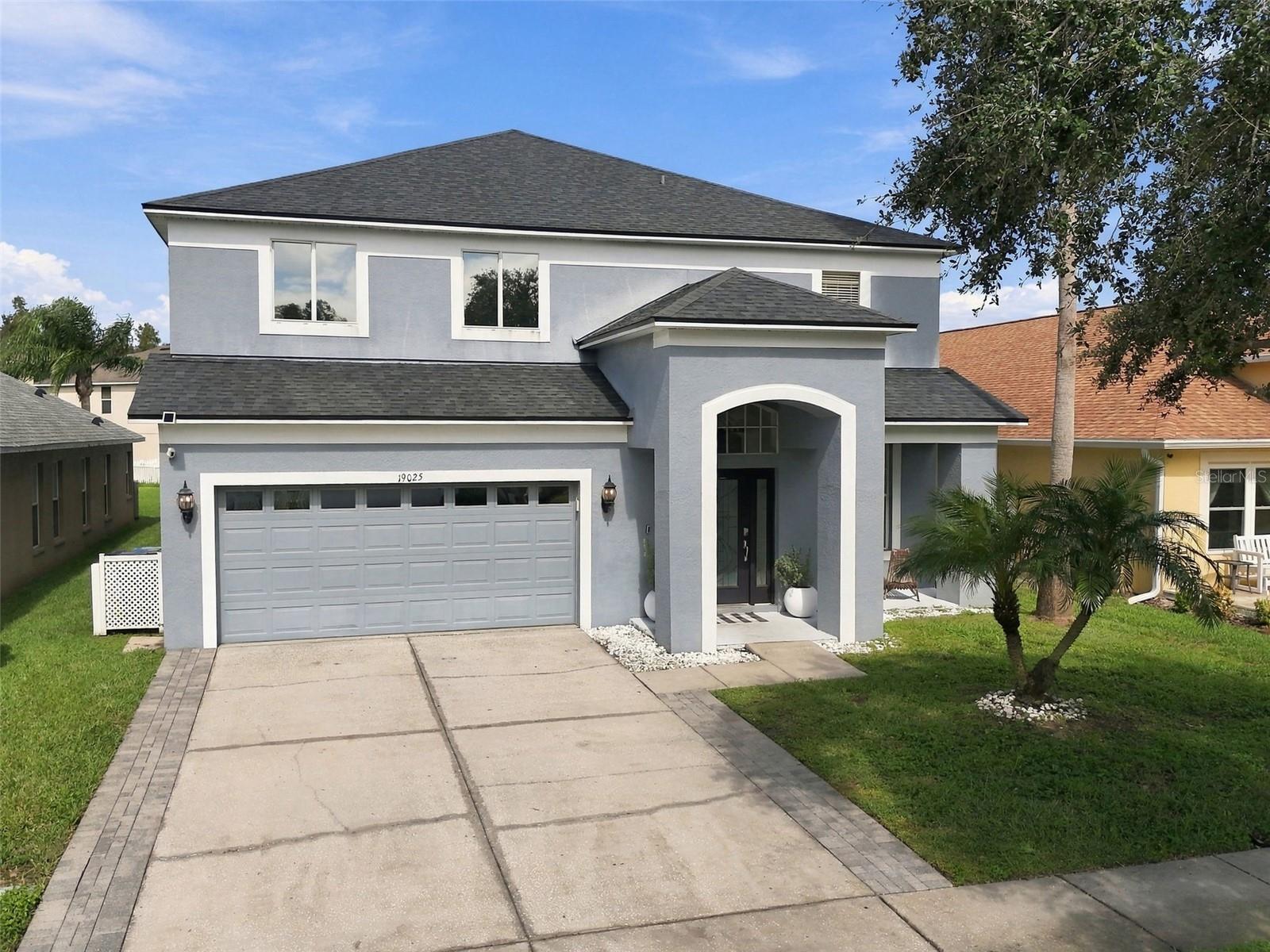 Welcome to this beautiful 2,930 sqft pool home featuring 4 bedrooms, 3.5 bathrooms, and a versatile flex space designed to fit your lifestyle! Upon entering your home you will immediately notice your home's open floor plan with a warm welcoming entrance into your formal living and dining areas that flow seamlessly into your main living space. Your home features large windows throughout allowing for natural light while taking advantage of the views of your outdoor pool. Your large kitchen will serve as the heart of the home with a walk-in pantry and a built in workspace. Your kitchen and family room offers easy access to the pool and upstairs showcasing the beautiful wooden staircase banister. Upstairs, enjoy a thoughtfully designed split floor plan with a secluded primary suite offering a peaceful retreat at the end of the day.  The suite includes a detailed tray ceiling, an additional flex room that can be customized to suit your needs, whether you envision a home office, sitting area, workout space, or private retreat. The spacious primary bathroom is designed for relaxation, featuring a soaking tub, walk-in shower, and double vanities. You will appreciate the double walk- in closet for all your storage needs. All 3 secondary bedrooms and two secondary bathrooms are conveniently located upstairs, providing comfortable accommodations and a functional layout.  Next, step outside to your own private backyard oasis! Enjoy the screened-in pool area, large covered lanai, and fully fenced yard, perfect for relaxing, entertaining, or enjoying Florida's outdoor lifestyle year-round. Beautiful landscaping enhances privacy, while the picturesque pond setting adds a peaceful backdrop to this lovely property. With generous living spaces, a flexible layout, a private pool, and a serene pond view, this home offers the perfect blend of comfort, functionality, and Florida living. Come see all the possibilities of this beautiful home! This home is located in the sought after Lutz community of Heritage Harbour featuring a resort stye pool, full gym, clubhouse restaurant and many organized social events to bring the neighborhood together!  Roof 2021