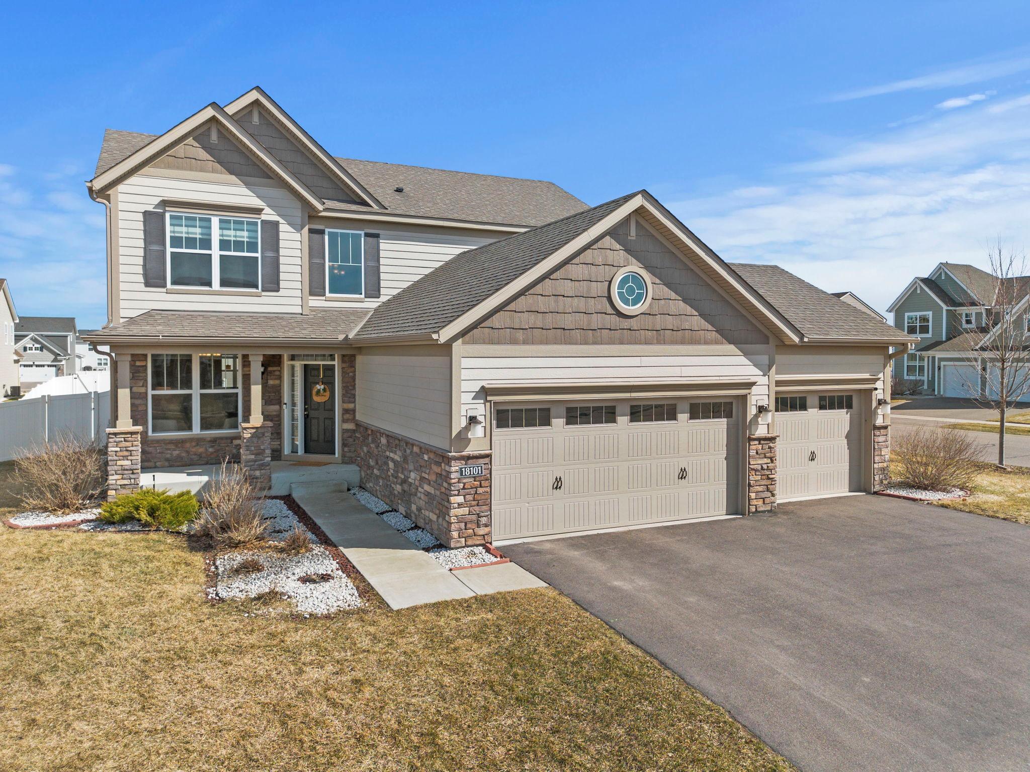 Stunning 5-bedroom, 4-bath two-story home in the sought-after Avonlea community of Lakeville, on a desirable corner lot with one of the largest backyards in the neighborhood. Located in Lakeville ISD 194 with community bus service to Seven Hills Preparatory Academy. Enjoy neighborhood amenities including a fitness center, party hall, trails, parks, playgrounds, and the soon-to-open Grand Prairie Park with pickleball courts, cricket ground, and children’s playground. The chef’s kitchen features abundant cabinetry, granite countertops, a large center island, stainless steel appliances (2024 gas range & dishwasher), and LVP floors flowing into the dining area with walkout to patio and fully fenced backyard. Main-level living room has new carpet, gas fireplace, recessed lighting, and backyard views, plus a flex room for dining or office and a half bath. Upstairs includes 4 bedrooms with new carpet, including a primary suite with walk-in closet, dual granite vanities, soaking tub, and walk-in tile shower. Bedrooms 2–4 share a full bath, and upper-level laundry adds convenience. Finished lower level (2024) offers fresh paint, new carpet, a family room pre-wired for 11.1 surround sound, 5th bedroom, and a 3/4 bath with walk-in shower. Additional highlights: attached 3-car garage, new patio (2025), fence (2023), egress window cover (2025), LG AI washer/dryer (2025), landscaping rock (2021), gutters (2020), and Rain Bird irrigation (2019). Move-in ready with extensive updates, generous living space, and exceptional amenities!