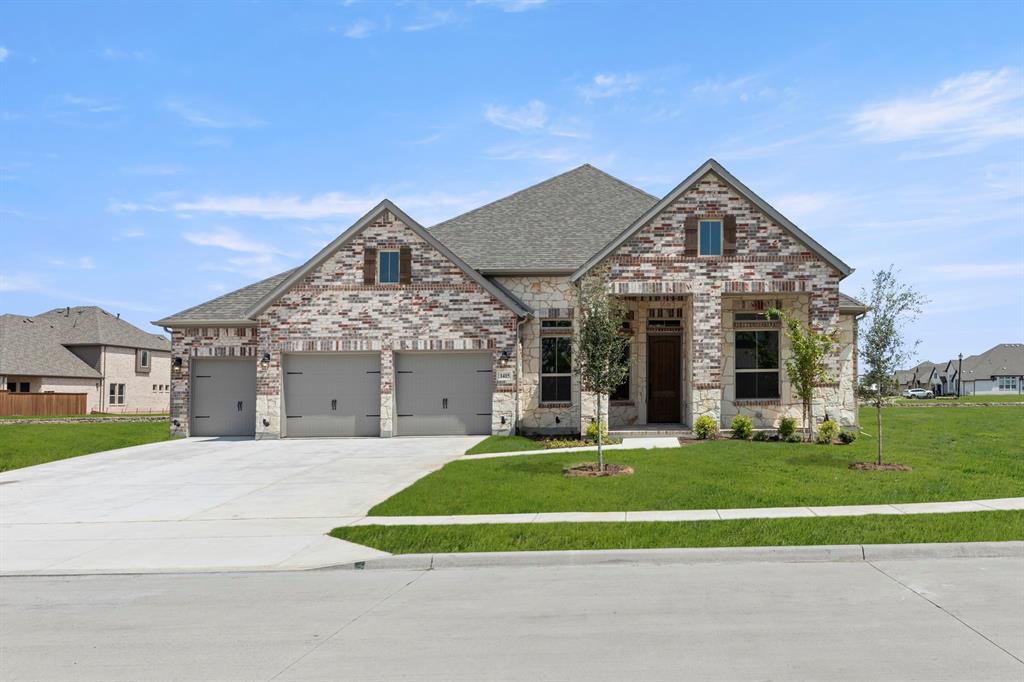 MLS# 21355230 - Built by Windsor Homes - Ready Now! ~ This Bryan plan home features 4 bedrooms, 3 bathrooms, and a 3-car garage, perfect for additional storage. The kitchen includes upgraded appliances and opens to the main living areas, creating a central gathering space. A dedicated study with French doors provides privacy for work or hobbies, while the game room offers additional space for entertainment. The dining room is enhanced by a window seat that adds character and functionality. The beautiful hardwood flooring extends through the main living areas, and the extended covered patio expands the home's outdoor living space for year-round enjoyment.
