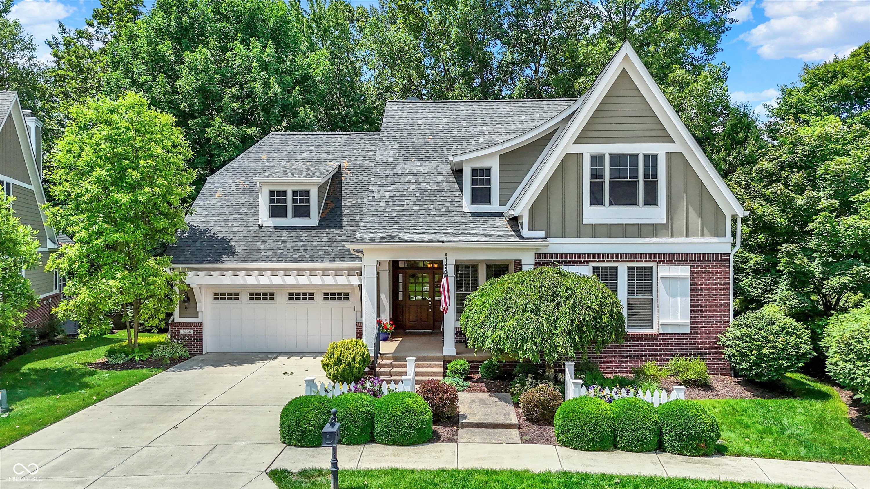 OPEN HOUSE SUN., 3/1, 12-2PM. In the coveted and gated Bridgewater Parks, this home is defined by its backyard retreat. Mature trees add privacy and a raised patio with a stone fireplace create a peaceful setting with direct access to community walking trails and the soon to be updated and improved neighborhood park. Thoughtfully maintained by its owners, the home offers a blend of functional spaces and inviting gathering areas designed for everyday living and entertaining and 2 car tandem garage. Upon entry, a built-in sitting bench provides a welcoming and practical touch for guests. The main level features a dedicated office and a bonus room with access to a full bath, allowing the space to serve as a bedroom if desired. The dining room includes a half wall that opens to the great room, creating an open yet defined layout. The kitchen is appointed with white cabinetry, granite countertops, a center island, and double ovens. The great room offers a fireplace w/ built in windows & shelving, while the breakfast area overlooks the backyard for relaxed mornings at home. A covered deck extends the living space outdoors with steps leading down to the patio and fireplace. The primary bedroom has laundry conveniently located just across the hall. Primary bath includes dual sinks, a walk-in shower, and a soaking tub & sculptured glass window. The finished lower level features full windows throughout and designed for entertaining, complete with a game area, full wet bar with bar-top seating, two additional bedrooms, a full bath, and generous storage. Beyond the home itself, residents enjoy the lifestyle that comes with living in Bridgewater- access to miles of walking trails, neighborhood park, and social membership at The Bridgewater Club, offering championship golf, indoor and outdoor pools, fitness facilities, tennis and pickleball courts, dining, and a vibrant year-round social calendar. It's a community designed for connection, recreation, and everyday enjoyment.