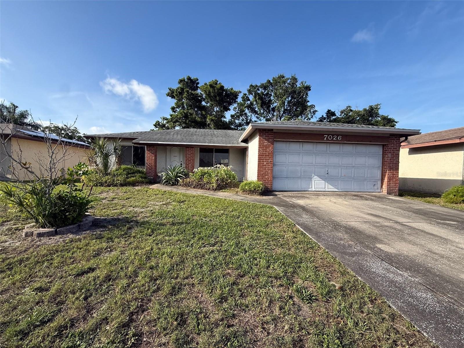 Investor special with incredible upside potential in a centrally located Pinellas County community! This 3-bedroom, 2-bathroom home offers a desirable split floor plan featuring a spacious primary suite with an en suite bathroom and walk-in closet. The large living and dining area provides an open layout filled with abundant natural light, along with sliding glass doors leading to the backyard.Flooring has already been removed in the main living areas, creating a blank slate for your renovation vision. Two guest bedrooms currently feature carpet, while the primary bedroom has linoleum flooring. Original kitchen and bathroom finishes offer the perfect opportunity for customization and value-add improvements. The home also features generous room sizes, mature landscaping, an indoor laundry area, and a 2-car garage.Major updates include a roof replacement completed in 2018, providing peace of mind for years to come.Step outside to a sizable backyard with room to create your ideal outdoor retreat, garden space, play area, or entertaining setup. The sidewalk-lined neighborhood adds to the home’s everyday livability and charm.Conveniently located near shopping, dining, parks, schools, and everyday conveniences, this home also offers quick access to US-19, Park Boulevard, and I-275, making commuting throughout Tampa Bay simple. Just a short drive to downtown St. Petersburg, Tampa International Airport, St. Pete-Clearwater International Airport, and some of Florida’s top Gulf beaches.AC is operational. Water is currently off and will not be turned on for inspections or appraisals. Property is being sold AS IS with right to inspect. Cash or renovation loan buyers preferred.Whether you are looking for your next flip, rental investment, or personal renovation project, this property offers strong potential for the right buyer.