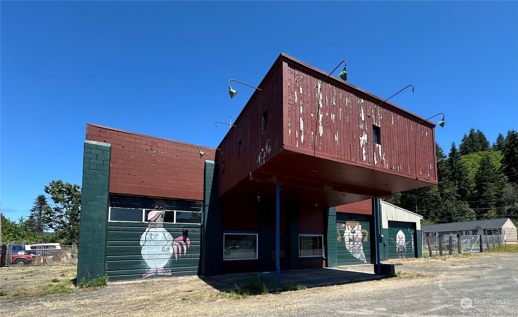 Own your own industrial shop as well as a home on the same property! Shop has 168' of frontage on State St. The home on the rear of property faces Main St. Work bldg is 4260 sq ft, 18' ceilings, hydraulic lift, HD or light duty mechanical. 553 sq ft apartment above shop. Main yard is fenced. Many kinds of mechanical machinery. Two 14' roll-up doors, One 10' roll-up door.  ADU home on site is 1774 sq. ft. 2BD/2BTH, den. Needs interior work done. Main floor 1024 sq ft, second floor 552 s ft. Cabinets for home are in shop. Buyer to do due diligence. SOLD AS IS.