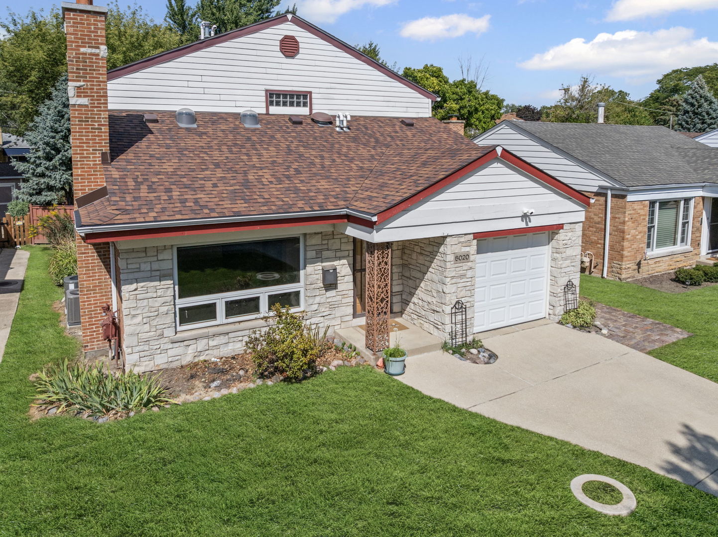 This stunning home in the heart of Edgebrook offers the perfect blend of timeless charm and modern upgrades. Featuring 5 spacious bedrooms and 3 full bathrooms, this property has been thoughtfully updated with quality craftsmanship throughout. Upon entering the home, you will be greeted with hardwood floors that flow seamlessly throughout the living and dining room. The main level welcomes you with a large front window that fills the living room with natural sunlight, a brick fireplace, bright dining area, and a dream kitchen with Silestone countertops, gorgeous 42" cabinetry, and premium appliances including a Bosch oven (2019), Samsung refrigerator (2018), and a brand-new dishwasher (2024). A convenient bedroom with a full hall bath(gut-rehabbed in 2014),makes this floorplan ideal for guests or related living. The family room, located adjacent to the four-season room, creates a perfect flow of space, bringing in natural light and offering year-round comfort. Upstairs are 3 generous size bedrooms with wonderful closet space. The hall bath is generous in size, which includes a stackable washer and dryer. The finished basement provides incredible flexibility, with a recreation room, wet bar, 5th bedroom, a cedar closet, full bath with steam shower,  and a 2nd laundry room with side-by-side washer and dryer and slop sink.  Comfort and efficiency upgrades include dual HVAC systems (Trane furnace 2024 upstairs, Lennox 2011 first floor), two central A/C units (Trane 2023 upstairs, Lennox 2016 first floor), a professionally installed A/C + heat unit in the sunroom and dual 40-gallon hot water tanks. Marvin windows throughout. A private brick-walled four-seasons room with sliding glass doors creates the perfect setting for year-round enjoyment. The backyard is perfect for entertaining. There is a fenced yard with a new back panel updated in 2025 and a free standing shed. Major exterior updates include a tear-off roof installed by Peterson Roofing in 2019, new gutters with gutter guards in 2021, a new chimney liner in 2022, and brick replacement with tuckpointing completed in 2023 by Bittner Construction.  Located within the boundary of top-rated Edgebrook Grammar School, this home is just a short walk to shops, restaurants, and Caldwell Woods with its scenic walking and biking trails. Golf enthusiasts will love the nearby Billy Caldwell Golf Course, and commuters will appreciate easy access to I-90/94, getting you to O'Hare or downtown Chicago with ease. Sold As-Is!