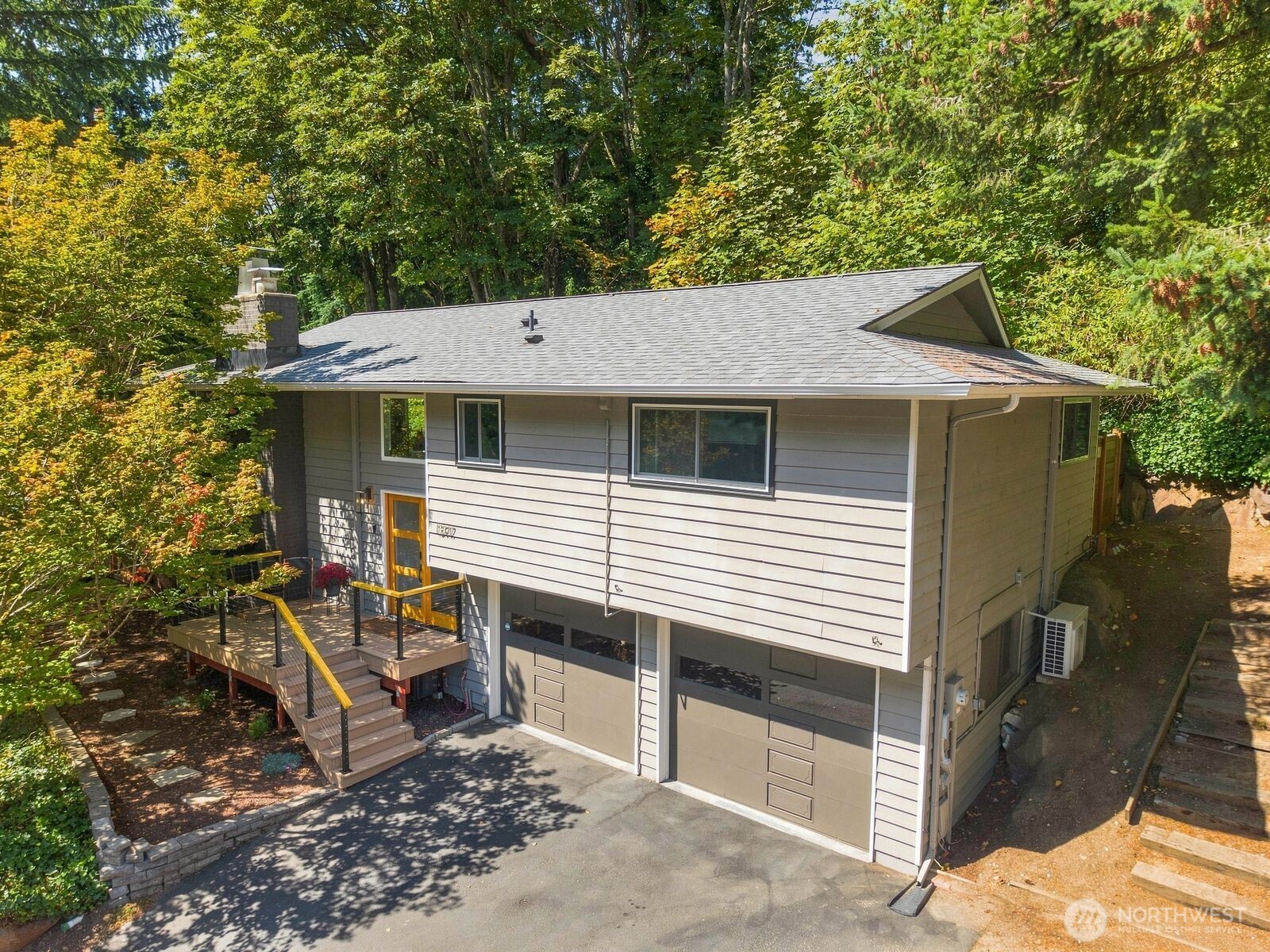 Get ready to fall in love! Tucked away on a quiet street near Seahurst Park and surrounded by lush greenery, this light-filled dream home offers privacy, personality and relaxed Northwest living. Artistic touches, glowing hardwood floors throughout and natural light from every angle give the interior an inviting and cheerful warmth. The open living, dining, and kitchen space creates the perfect setting for everyday life and entertaining, with a stylishly updated kitchen featuring quartz countertops, large center island and stainless steel appliances. Beautifully updated bathrooms reflect the home’s creative character, with thoughtful finishes and a curated, design-forward aesthetic. Downstairs, the spacious family room with wet bar offers flexibility for movie nights, play, hobbies, or a home gym or office. Outside, expansive composite decks, attractive low-maintenance landscaping, and a beautiful barrel sauna create a private, spa-like retreat. Complete with a separate laundry room, two-car garage, EV charging hookup, mini-splits for year-round comfort and a generator hookup. Excellent location blending beachfront and city access, just a short walk to nearby Seahurst Park with forested trails, playground, picnic areas, and a beautiful saltwater beach to enjoy every season, while only 15 minutes from downtown Seattle.
