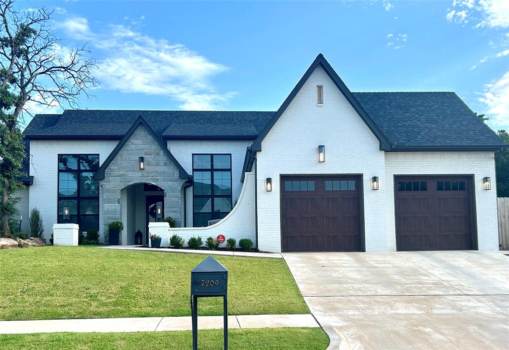 The high end finishes and gorgeous lighting make this home feel like your very own luxury custom! Expect to be wowed by the grand living area featuring a wood beamed cathedral ceiling and floor to ceiling brick fireplace! This open plan allows for seamless flow into to the kitchen and breakfast nook, and opens onto the extra large covered patio! Don't miss the gorgeous formal dining room, boasting 16 ft. ceilings and large window featuring luxury "Sheer Shadings" blinds with Bliss Automation! "Sheer Shadings" blinds are throughout the home making this home have very low energy costs.  This chef's kitchen includes high end appliances, a walk in pantry, a beautiful mix of stained and painted woods, tiles, gorgeous granite, and even a built-in cutting board above the trash! The private master suite offers a double vanity, free standing soaker tub, and a laundry room with sink just off the master closet! With this split plan, the secondary beds are opposite the master suite with a bathroom in between, featuring a pocket door for privacy between the sinks and shower/toilet area. A storm shelter located in the garage always makes everyone feel more safe during the storm season.  It's all the little extras that make this home so special! Don't miss this great cul-de-sac lot! Cottage Grove offers a great little park, fishing pond, and nature preserve with walking trails. Just minutes from all of the shopping and entertainment offered on the I-35 corridor.