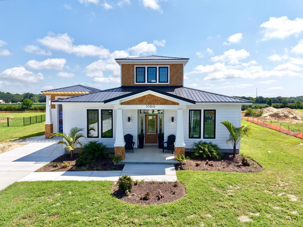 Welcome to The Vita A Terra “The Shore Life Starts Here.” This new 3 bedroom, 3 bath custom-built home offers 1,901 sq. ft. of stylish coastal living in Tower Hill Estates, just outside Cape Charles. Designed with comfort and charm, it features a rare pull-through boat garage plus covered front and back porches perfect for enjoying the salty breeze. Minutes from the sandy beaches, shops, dining, and harbor of Cape Charles, this home puts the best of the Shore at your doorstep. The Chesapeake Bay Bridge Tunnel is nearby for quick travel, while the peaceful setting offers small-town charm and relaxation.