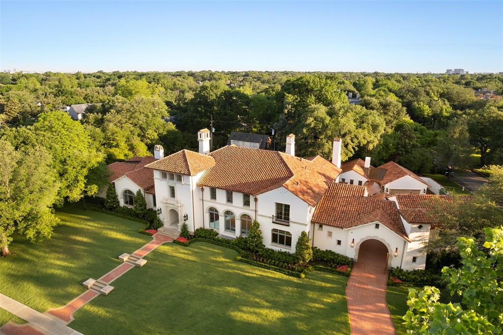 This Spanish Revival style estate is the finest new home built in Highland Park and should be finished by Sept 15. For all practical purposes, it is the last HP one-acre or larger lot that can be built on as others already have 10,000 sf+ homes on them. The nearly one acre of land is visually extended by being on the corner of the forested Armstrong Parkway, making it one of the most desirable one acre lots in Highland Park.  Its architectural significance is credited to architect Larry Boerder, landscape architect Harold Leidner and designer Margaret Chambers. The bespoke approach of the developer is reflected in the home’s structure, materials and design. Looking original, echoing the glamour of original 1920s Highland Park homes, the fresh design heightens the current appeal. The uninterrupted sightlines in every direction make the home more modern than many modern homes. You will immediately see how open the distinct rooms are to each other, allowing sunlight to flow through the home.  Walls of windows overlook the pool, lawn and gardens and accordion doors open to the loggias, furthering the connection to nature. You will appreciate the presence of Armstrong Parkway and the privacy of Belfort Place. Wonderful floor plan for a family or extended family, flowing spaces for entertaining. Every room becomes a lure. The guest quarters, pool house and its open-air kitchen extend the flexibility and enjoyment of the home. The quality of the structure includes 29 geothermal wells, deep piers and steel beams, a generator, carved Calacatta marble fireplaces, vintage Venetian hand-blown glass chandeliers, wrought iron pendants, lacquered walls, heated bathroom floors, elaborate beam ceilings, artisan tile, a La Cornue range. Balconies, porches, terraces and loggias extend the living spaces into the garden. You will find elegance, warmth and, most of all, a home you will love living in.