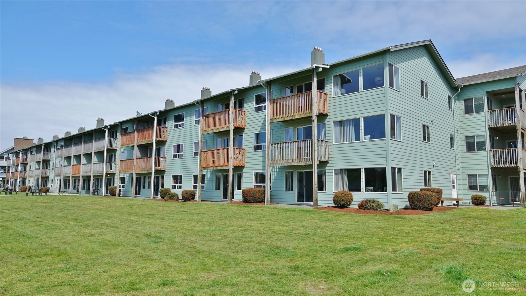 GROUND FLOOR, CORNER OCEAN Front HOTEL Condo! Located on the 1st-floor #102 in the Canterbury Inn in downtown Ocean Shores ~ Southwest Corner unit allows for lots of natural light and views of the Dunes located behind the property. Larger corner unit with 2 BD, 1.5 BA, and 980 sq.ft. Relax in this light and bright Condo, which is beautifully and comfortably updated and Fully-Furnished. Open Floor Plan with Laminate flooring through-out (tile in the bathrooms). Comfortable Living Room with a Propane Fireplace, hide-a-bed, and a slider to the Private Patio. Fully-equipped Kitchen with Eating Bar, all appliances, dishes, etc. The Main Bedroom features 2 Queen beds, and the 2nd Bedroom features 1 Queen bed and attached 1/2-bath. Dog-friendly unit (up to 75lbs) ~ the owner gets to share in 50% of the pet fees as income. Ran as a Hotel, so NO HOA Dues. Owners can stay up to 2 WEEKS/YEAR + up to 4-6 additional days. Cleaning Fee=$25/night-stayed. The Canterbury Inn offers a heated indoor pool and hot tub, exercise room, social room, outdoor dog area, backyard lawn area and patio, and a 24-hr front desk. The exterior of the Building was remodeled in 2023.