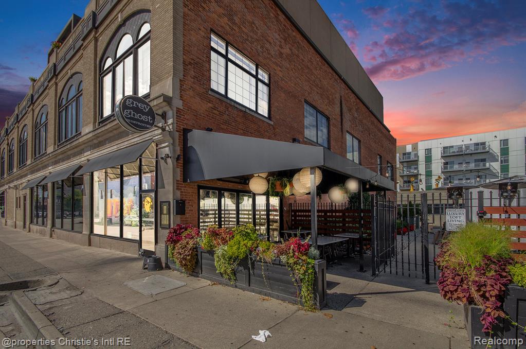 Enjoy true loft vibes at Crystal Lofts in Brush Park! This expansive bi-level condo features two bedrooms, two full bathrooms and two lofted spaces + tons of character- exposed brick & polished concrete! The coveted NEZ-Rehab tax abatement keeps taxes low! Open floorplan with oversized windows & double height ceilings in the main living space lets in tons of natural light. The first floor includes a full bathroom, dining & living room, kitchen w/ island & bar seating, in-unit laundry and large bedroom (or flex space) with bonus loft. Take the open stairwell up to the lofted second level which features a primary ensuite with walk-in closet and a full bath with shower & separate tub! Enjoy outdoor space on the top floor communal terrace! Includes 1 parking space in secure gated lot! Secure entrance to parking lot and lobby. The building is conveniently located on top of Grey Ghost, James Oliver Coffee, and by Second Best, Bakersfield, & many other Brush Park hot-spots! Along the Q-LINE and close to everything- Little Caesar's Arena & other sports venues, theaters, museums, shops & restaurants, groceries!
