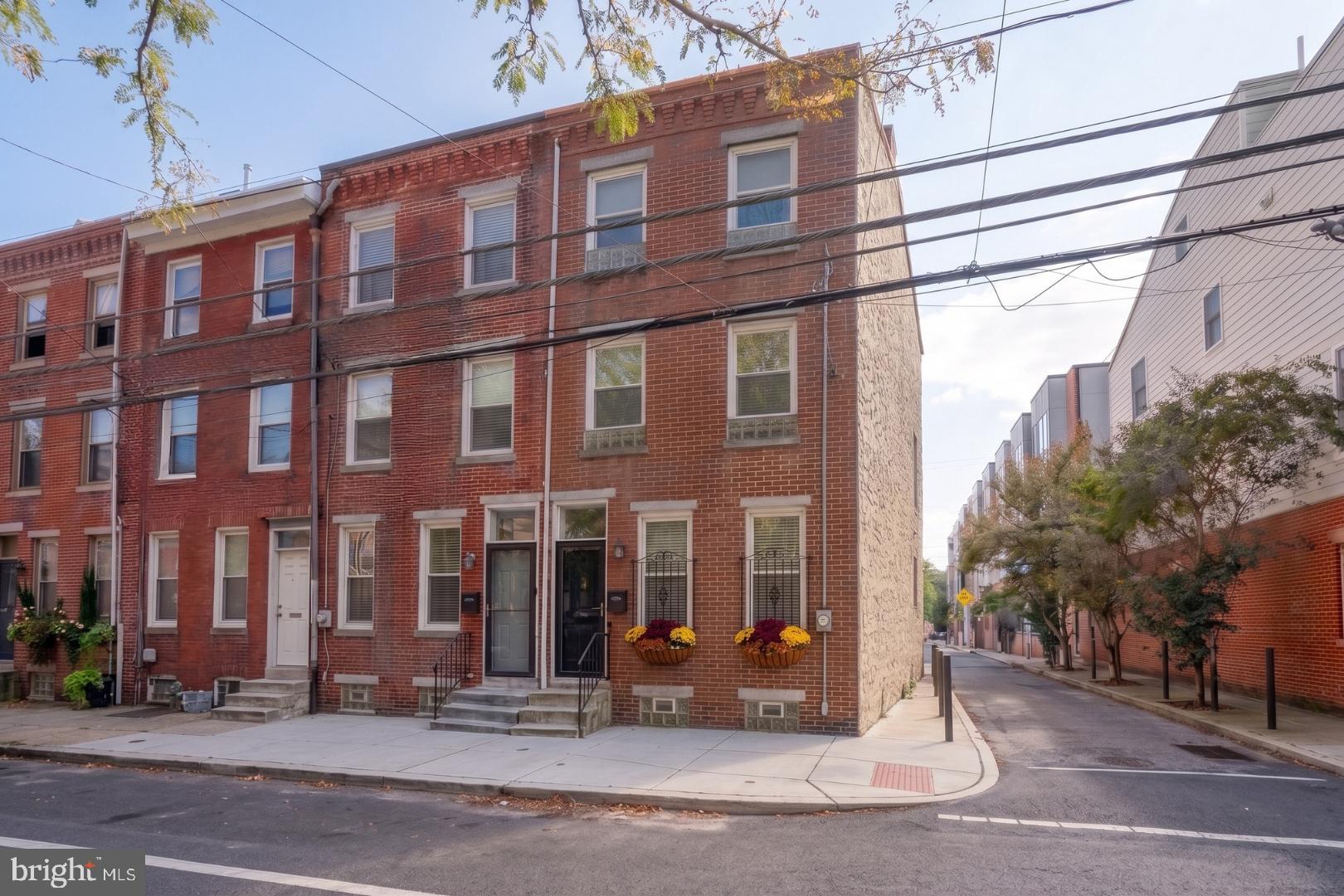 Welcome to this beautiful, classic townhome nestled in the heart of Graduate Hospital, one of Philadelphia’s most sought-after neighborhoods. This charming updated 2 Bedroom, 2.1 Bath home is not to be missed! Enter into the bright, open Living Area with high ceilings and hardwood flooring, which flows into the updated Kitchen with white cabinetry, quartz countertops, and stainless appliances. Off the Kitchen, a private patio creates the perfect outdoor retreat for relaxing or entertaining guests. Also on the main level is a Powder Room and stairs leading to the finished Basement.Upstairs, the second floor features a spacious Bedroom, Full Hall Bath, a Laundry Area and linen closet. The entire third floor encompasses the wonderful Primary Suite with vaulted ceiling and extra lofted storage, a walk-in closet, and en-suite Bath with glass-enclosed shower. The finished Lower Level features a versatile Bonus Room—perfect for a home office, gym, playroom, or media space—plus extra storage. UPDATES INCLUDE: New Roof (2026), New Hot Water Heater (2026), New Vanity in 2nd floor Hall Bath (2026), New Stucco - back of house (2026), Full Basement Renovation (2025), New Sump Pump (2025), New Flooring in Basement (2024), Updated Kitchen, including all New Kitchen Appliances, Flooring and Fixtures (2021), Updated Powder Room (2021). Situated within close proximity to Rittenhouse Square, Center City, Fitler Square, University City, restaurants, shops, major hospitals and universities, this gem has it all.  Experience the best of Philadelphia city living in this beautiful home. Schedule your appointment today!