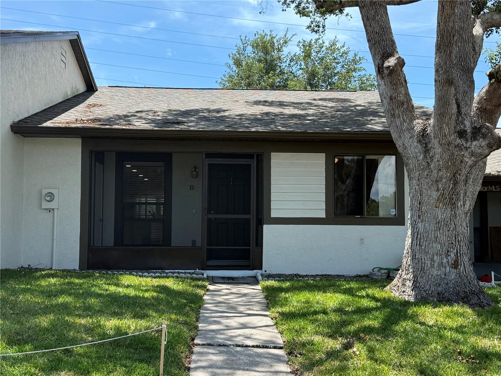 Beautiful bright and cheerful villa in the desirable community at Villas of Beacon Grove. This 2 bedrooms, 2 baths with 1,030 sq ft has a brand NEW ROOF (2026), a NEW Water Heater (2025), NEW laminate flooring on the living area, and BOTH bathrooms have been UPDATED as well. The 2 bedrooms also have laminate flooring (NO carpet in in this villa)! As soon as you walk in, you will love how bright and cheerful this villa is and will ove the open floor plan! The Sunroof is an added bonus and it's a great flex room to make it whatever you like as it has both central AC and heat as well, and has a laundry closet for a full washer and dryer (conveys with the sale). The front porch is fully screened in and has a storage closet! The community has a low monthly HOA fee of $166 that includes maintenance grounds, cable, internet, trash, water, clubhouse and a pool. This is truly a great opportunity to purchase a move-in ready home! Centrally located in Palm Harbor!