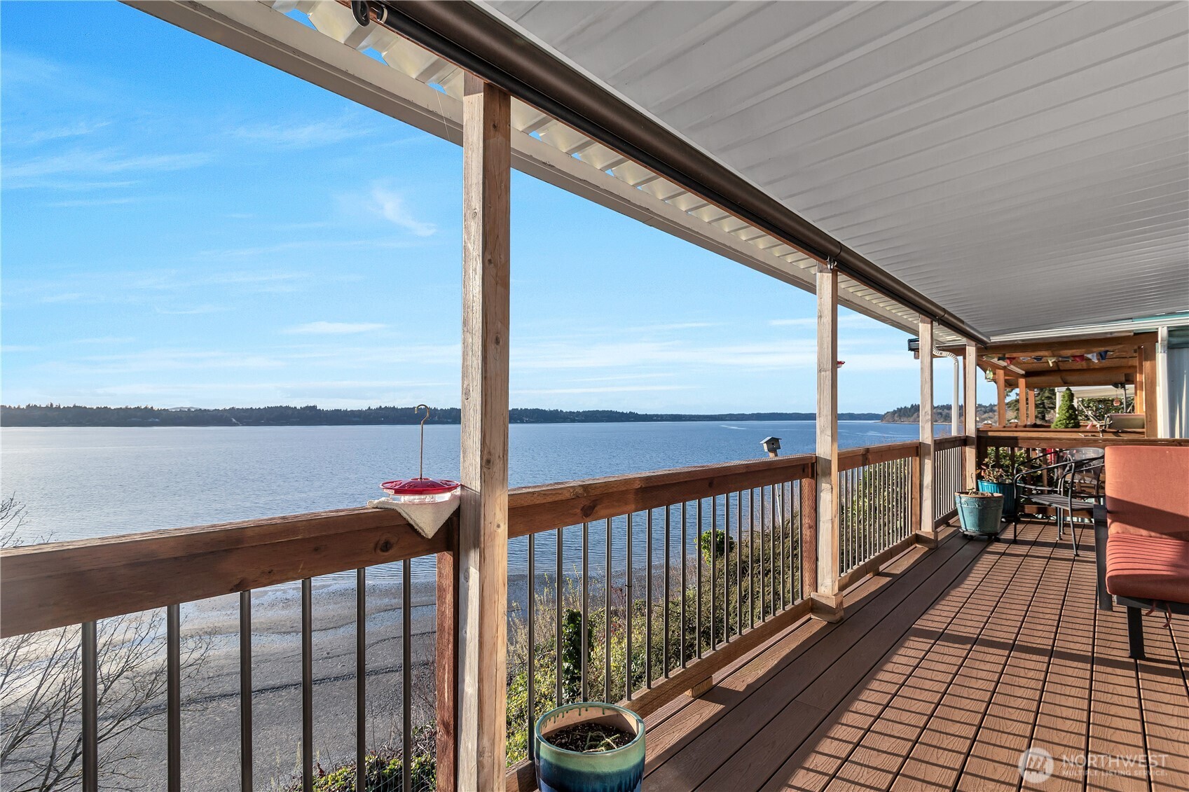 Experience waterfront whale watching right from your own living room. Built in 2014, this thoughtfully designed home features 2 bed, 2 bath, plus a dedicated office and a well-appointed kitchen with updated appliances. Notable upgrades include durable Trex decking, hardie siding, a newer metal roof with added insulation, and reinforced walls for added efficiency and peace of mind. Expansive picture windows showcase stunning views of Budd Inlet and the Olympic Mountains, while the wrap-around covered porch offers the perfect place to relax in comfort. Don't miss this opportunity to enjoy peaceful coastal living in a scenic setting. community amenities include a heated outdoor pool, workshop, club house, & private beach trail.