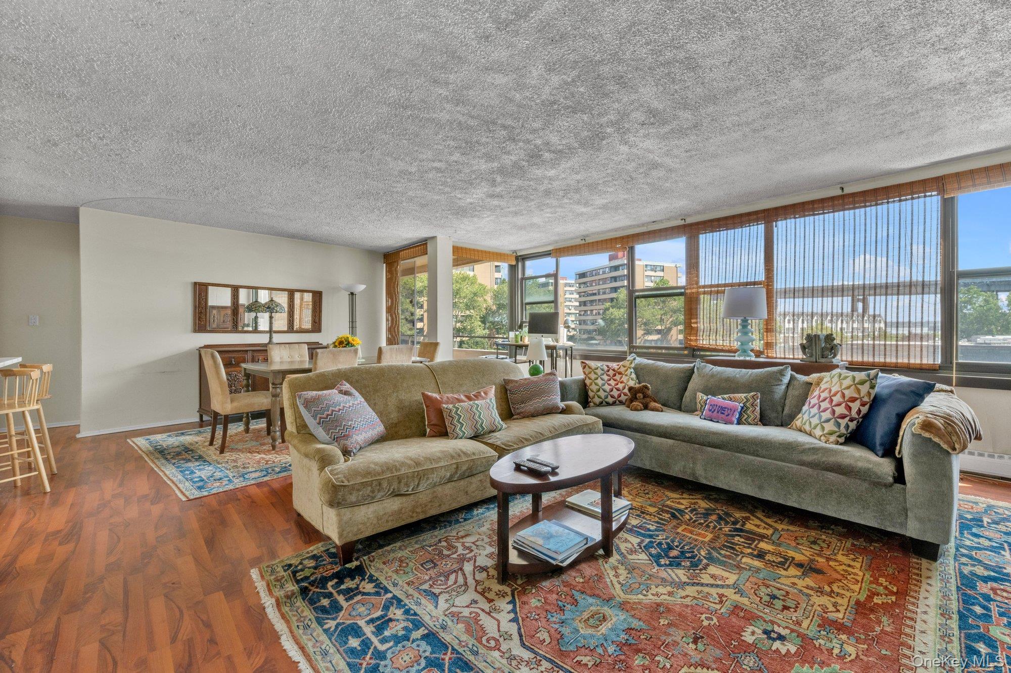 Water and bridge views from this eastern exposure unit with loads of sunlight.  New custom kitchen with stainless appliances and granite countertops.  Updated Bath.  Laminate flooring.   Expanded open concept living room and dining room combined with access to terrace from the dining room and master bedroom. Prime parking space available for transfer.  Lehavre offers tennis, pools, cafe, clubhouse with full gym and exercise classes.