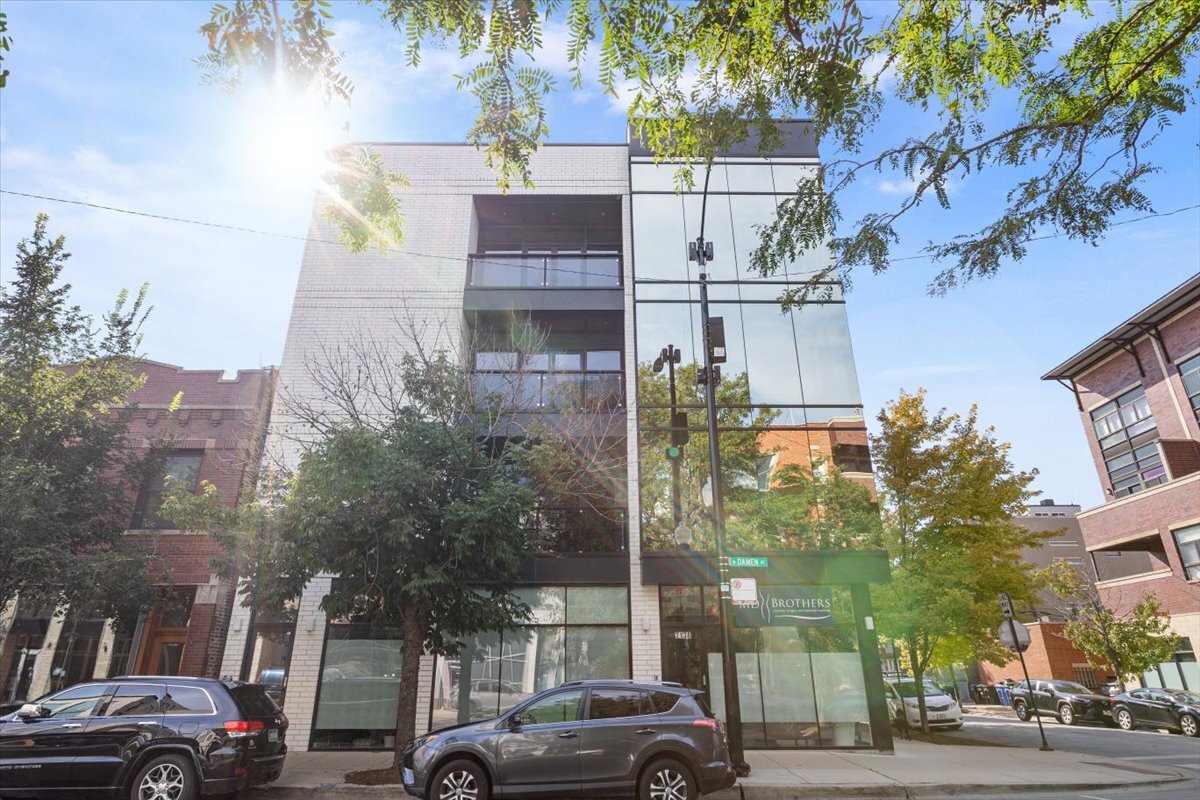 This full floor, luxury Bucktown home is truly one of a kind. Take an elevator straight from one of your 2 heated/attached parking spaces directly to the unit's foyer. Luxurious finishes adorn the entirety of the condo, which lives like a Single Family Home. Beyond the entry foyer find the kitchen/living/dining areas, which share views of an elegant see-through fireplace, floor to ceiling windows, designer light fixtures, and numerous luxe finishes (heated wood floors, quartz counters, integrated storage, designer lighting, European appliances -- no millimeter has been left to upgrade). The kitchen is fit for the most serious of chefs and enthusiastic entertainers, sporting a Miele integrated coffee machine, European appliances, double ovens, double dishwashers, double beverage coolers, an ice maker, a pot-faucet, and loads of storage. The kitchen and living areas boast 2 private outdoor spaces. Additionally, the generous 2400 sf of living space includes 3 bedrooms and 3.5 baths, each bedroom with an ensuite bath, a generous footprint and abundant storage. The primary bedroom offers his and hers closets, an attached bath with separate shower and tub, and serves as entry to the crowning jewel of the home: a walk-out, 1400 square foot patio, boasting a fire pit, covered seating area, turfed game zones, and bbq/dining area. Enjoy this spectacular space, day and night. An A+ Bucktown location with easy access to the highway makes this location an ace. In addition, it is situated within walking distance to all of Bucktown's hotspots. One must see it to fully grasp just how special and stunning this home lives.