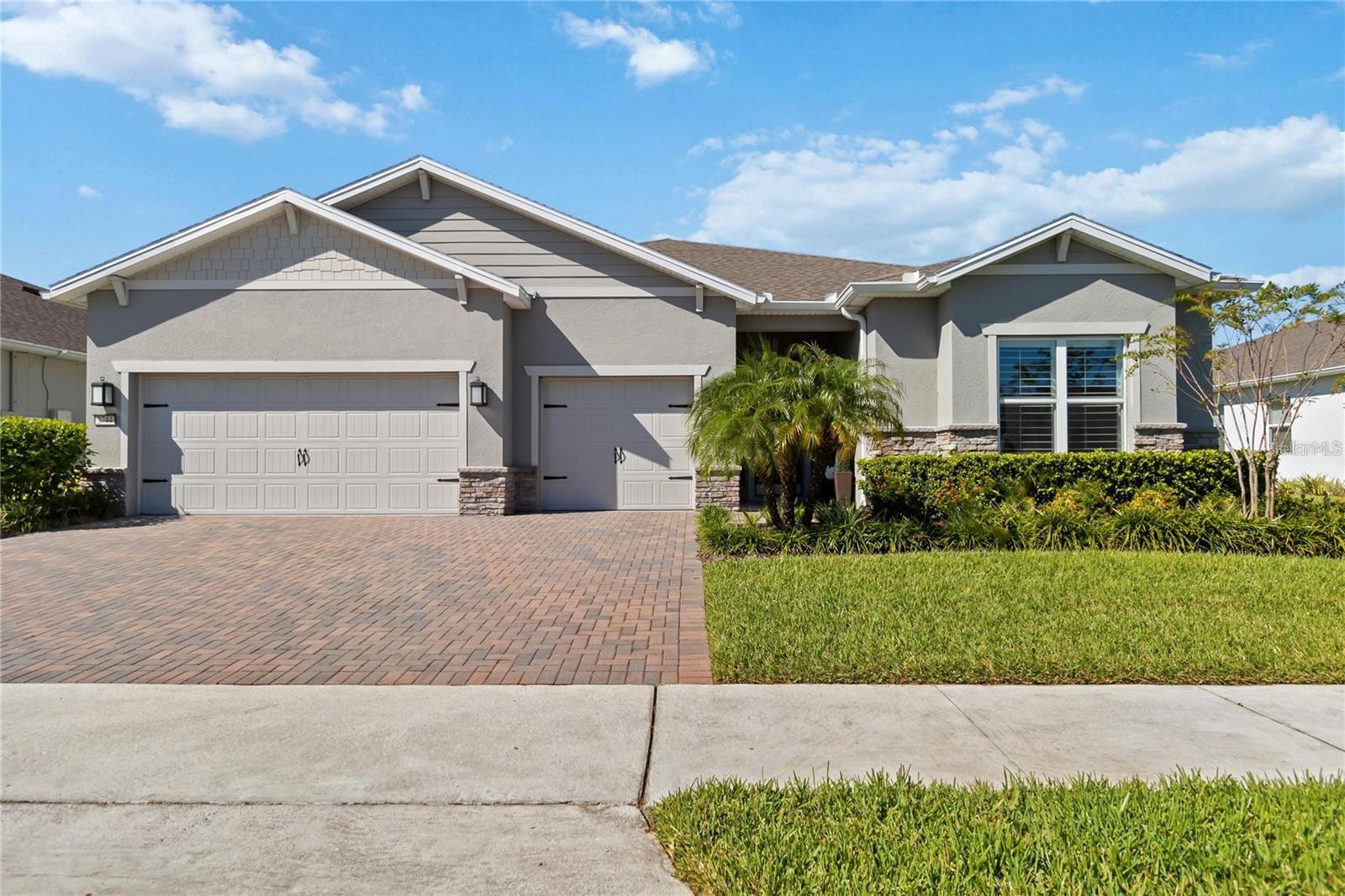 This is the one!!  The renown floor plan in Del Webb Sunbridge 55+ on beautiful water with so many upgrades!  You can just move in!  How about a $0 electric bill?  Home boasts enough owned solar to cover the house, spa and pool utilities. There is enough extra solar to cover an electric car charging station if you want to add.  There is a 30 transferable warranty on the solar!The home has so many custom features: plantation shutters, custom closets, crown molding, upgraded lighting, remote controlled screen  for lanai, panoramic screened lanai, outdoor kitchen, upgraded appliances, and epoxy floored garage. The heated pool has a sun deck and sits beautifully near the pond.Community offers a resort pool, a separate resistance pool tennis, pickleball, clubhouse, art classes, cards, games, and a life style director.  But best of all are all the friends.