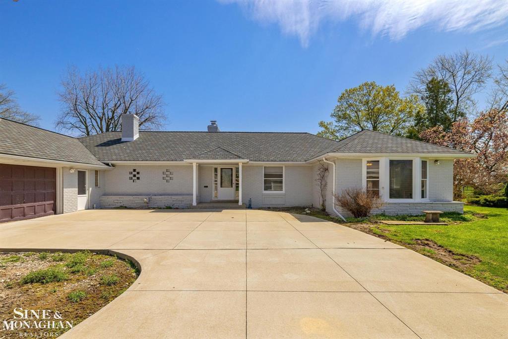 Nautical Mile Gem! Stunning waterfront opportunity with 132.5' of frontage and direct lake access on Lake St. Clair, protected by a 132.5' steel sea wall. The property features approximately 1.4 acres, a 200 ft dock, extensive new cement work, and an extraordinary 4,329 sq. ft. garage complex-unlike anything else on the lake. With 9-10 stalls, multiple 8' overhead doors into areas with roomy 10' ceilings, and a mega-sized RV bay (29' wide x 56' deep x 15'- ceilings, 14' OH door), this is a dream setup for car collectors, RV & boat owners, or anyone needing an unmatched storage & workspace capacity. The garage space includes approximately 3,741 sq. ft. attached plus 588 sq. ft. detached. While the residence allows room for updates, the seller has strategically priced at $1,249,000 based on land value, waterfront, dock, and brand-new garage enhancements including one full bathroom (stub-in prepped) plus extra-wide stairs to the approximate 2,371 sq. ft. of bonus space prepped above (with inviting vaulted ceiling areas). A rare chance to secure premier Lake St. Clair waterfront living with one of the largest garage facilities in the area. All within walking distance of restaurants, parks, new city Activity Pier, newly renovated city pool plus a new bath house in the Spring 2026, and shops. Just 5 minutes to access I94 & 696. This great family community is situated close to everything but still feels as peaceful as northern Michigan without leaving the city. Driveway accessible from a safe and quiet residential street. Only 25 minutes to visit metropolitan attractions, sporting events, concerts, casinos, entertainment & restaurants in downtown Detroit/Canada, Royal Oak & Novi.