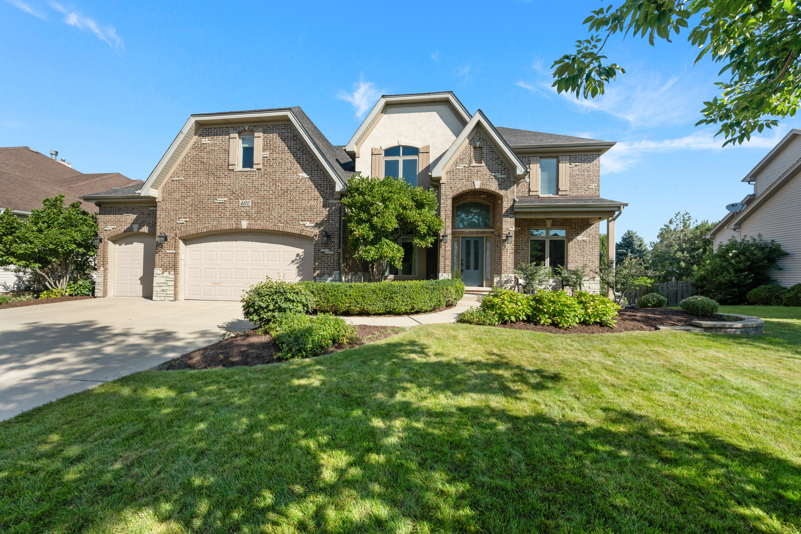 Located within the sought-after custom home community of Deerpath Trails, this exceptional home offers an impressive combination of space, functionality, and fine finishes. A four-car garage provides ample parking and storage, while the deep-pour basement offers an additional full bedroom and an abundance of unfinished space ready to be customized to suit your needs.    The open-concept main level features an array of beautiful details, including wainscoting in the dining room and crown molding throughout the split-entry living and dining areas. Tucked away at the back of the first floor, the spacious den/office provides a quiet and private workspace.    The expansive kitchen is designed for both everyday living and entertaining, featuring a large eating area, oversized island, and abundant cabinetry and storage. Glass sliding doors lead directly to the freshly stained deck and granite patio, creating an easy transition between indoor and outdoor living. The kitchen also connects seamlessly to the dining room through a fully appointed butler's pantry.    A generous laundry and mudroom offers exceptional functionality with extensive storage and space for keeping everyday essentials organized.    Upstairs, you'll find three full bathrooms along with a versatile bonus room-perfect for movie nights, cheering on your favorite sports team, a playroom, or settling in for a good binge-watch. The spacious primary suite features a comfortable sitting area, while the luxurious primary bath offers dual sinks and an ample walk-in closet.    With its generous living spaces, thoughtful layout, extensive storage, and room to customize, this Deerpath Trails home offers an exceptional opportunity to make a truly special property your own. New roof in 2019 and so much more. For a full list, see Additional Information.