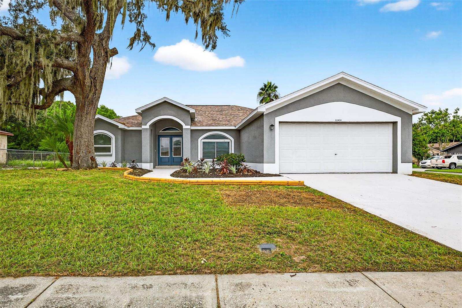 One or more photo(s) has been virtually staged. SELLER IS OFFERING A 1 YEAR HOME WARRANTY AND UP TO $10,000.00 IN CONCESSIONS TO HELP BUYERS WITH CLOSING COSTS!
3/2/2 has  a bonus 4th bedroom/ Home office retreat!  REMODELED HOME INSIDE AND OUT! NO FLOOD ZONE,HOA 52.00/ year !  ROOF 2024 , AC 2024, WATER HEATER 2025 Luxury Kitchen upgrades, Spa Theme Bath Upgrades! Brand new LVP flooring . HIGH CEILINGS  BRAND NEW shaker kitchen cabinets, BRAND NEW  quartz countertops, BRAND NEW stainless steel appliances, brand new fans and lighting throughout, fresh landscaping, fresh paint inside and out. PRIMARY SUITE OFFERS LARGE 9X12 WALK-IN CLOSET A SOAKING TUB IN PRIMARY BATH WITH DUAL SINKS AND WALK IN SHOWER Large corner lot with plenty of room for parking.