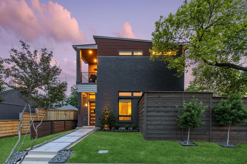 Built in 2016 with exceptional attention to detail, this home delivers modern design and serious livability in the heart of Old East Dallas. Step inside to 11-foot ceilings, museum-finish level 4 smooth walls, 8-foot solid-core doors, and hardwood floors throughout. A double sided floor-to-ceiling fireplace anchors the living and dining room, creating an open layout that's perfect for hosting and entertaining. The chef's kitchen features quartz countertops, an oversized island, Jenn-Air stainless appliances, custom cabinetry, and a built-in wine fridge. All three bedrooms are upstairs with their own en-suite bathrooms. The primary suite includes a private balcony with Dallas skyline views, soaking tub, oversized multi-head shower with built-in bench, dual vanities, and a massive walk-in closet. The multiple outdoor spaces highlight the home, with a decked and covered side patio, a landscaped courtyard, and a tucked away balcony off the primary. Downstairs you will also find a light-filled office that satisfies all work from home needs, and opens up to the patio as well as the garage. Other notable items include: surround sound speakers inside and out, custom window treatments, wired security system, spray foam insulation, and 2x6 walls instead of 2x4 which allows for additional insulation.