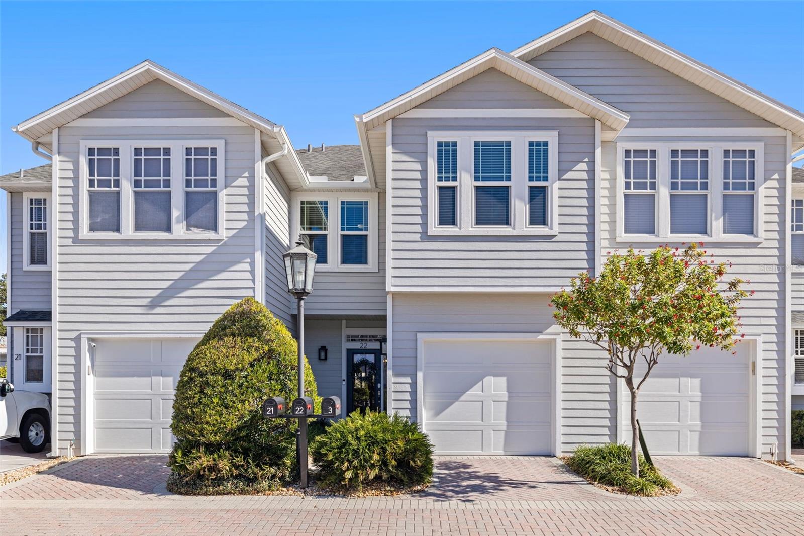 Under contract-accepting backup offers. Located within the gated enclave of Village Gate in Hyde Park, this beautiful residence offers a rare combination of privacy, scale, and walkability in one of South Tampa's most sought-after settings, not in a flood zone. With only 29 residences, the community features paver-lined streets and a private pool and cabana exclusively for residents. The interior presents an open floor plan with gorgeous wood floors and a cohesive flow among the kitchen, dining, and living areas. The kitchen includes custom cabinetry, granite countertops, stainless steel appliances, and a gas range. The living room features a gas fireplace and opens through French doors to a private fenced outdoor living space. The second level includes a spacious primary suite with an en-suite spa-like bath, soaking tub, walk-in shower, and generous closet space. Two additional bedrooms, a full bath, laundry, and abundant storage complete the upstairs layout. Recent upgrades include hurricane-impact windows, a tankless gas water heater, and an updated HVAC system. Located just minutes from Hyde Park Village, downtown Tampa, and some of the city's most celebrated dining, including Bern's Steak House, within a short distance. This residence delivers the best of South Tampa living within a secure, boutique setting rarely available.